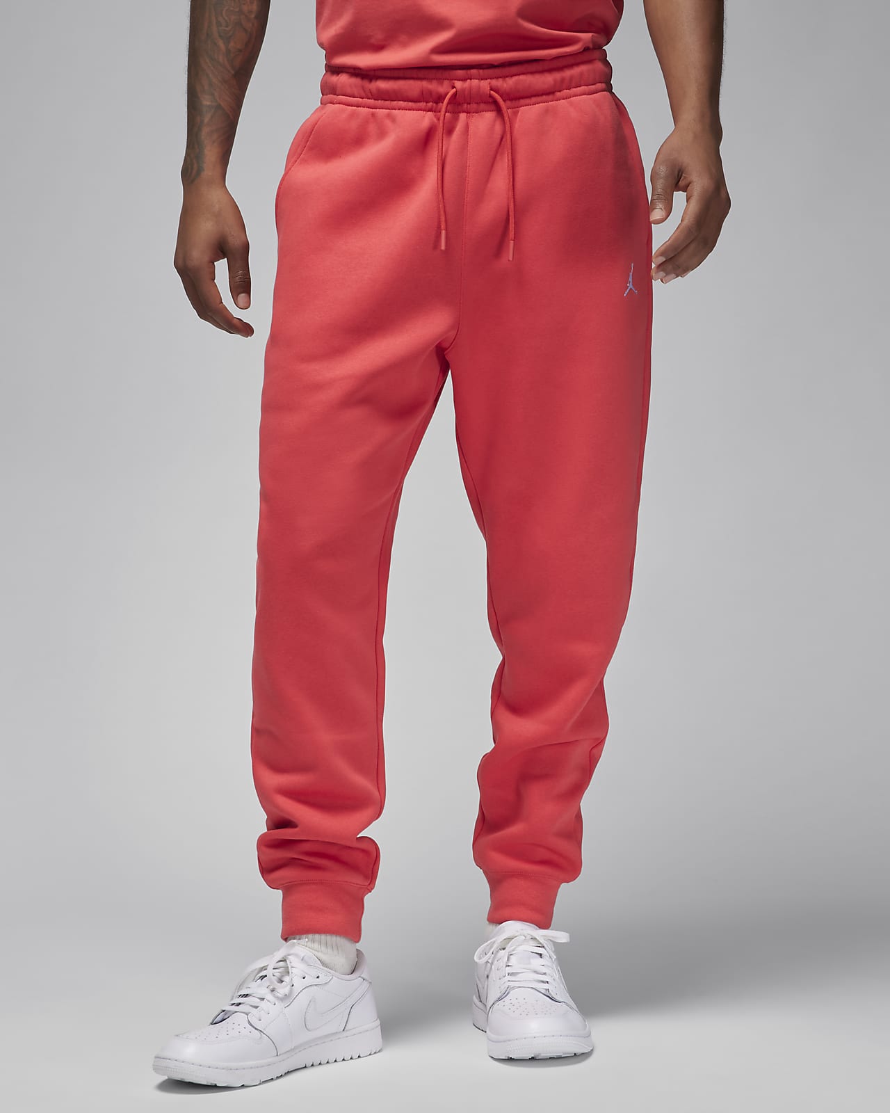 Men's red joggers with stars on the sides