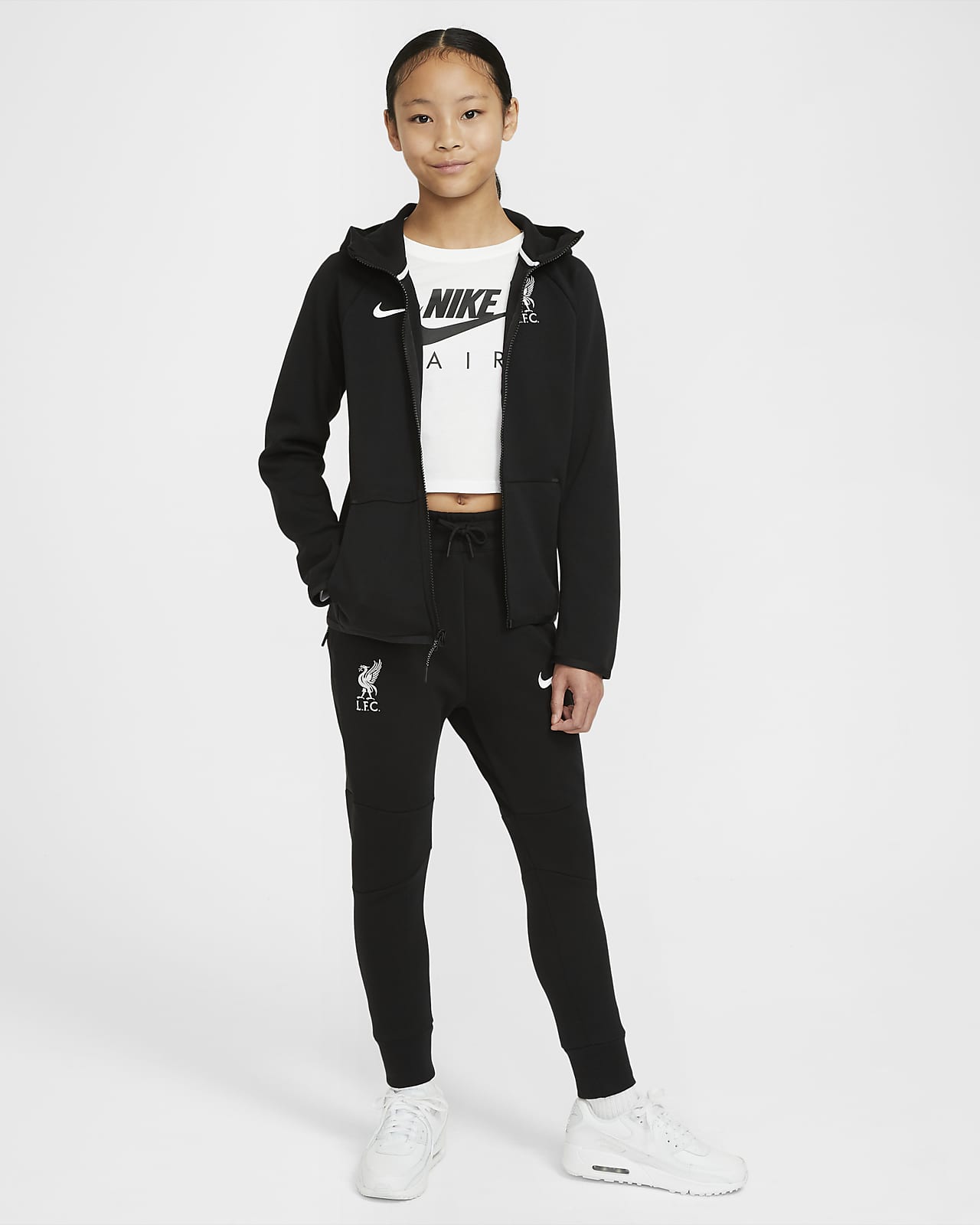 Liverpool F.C. Tech Fleece Essentials Older Kids' Full-Zip Hoodie. Nike MA