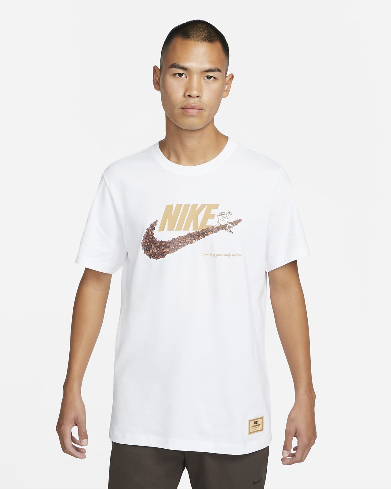 white nike shirt with gold logo