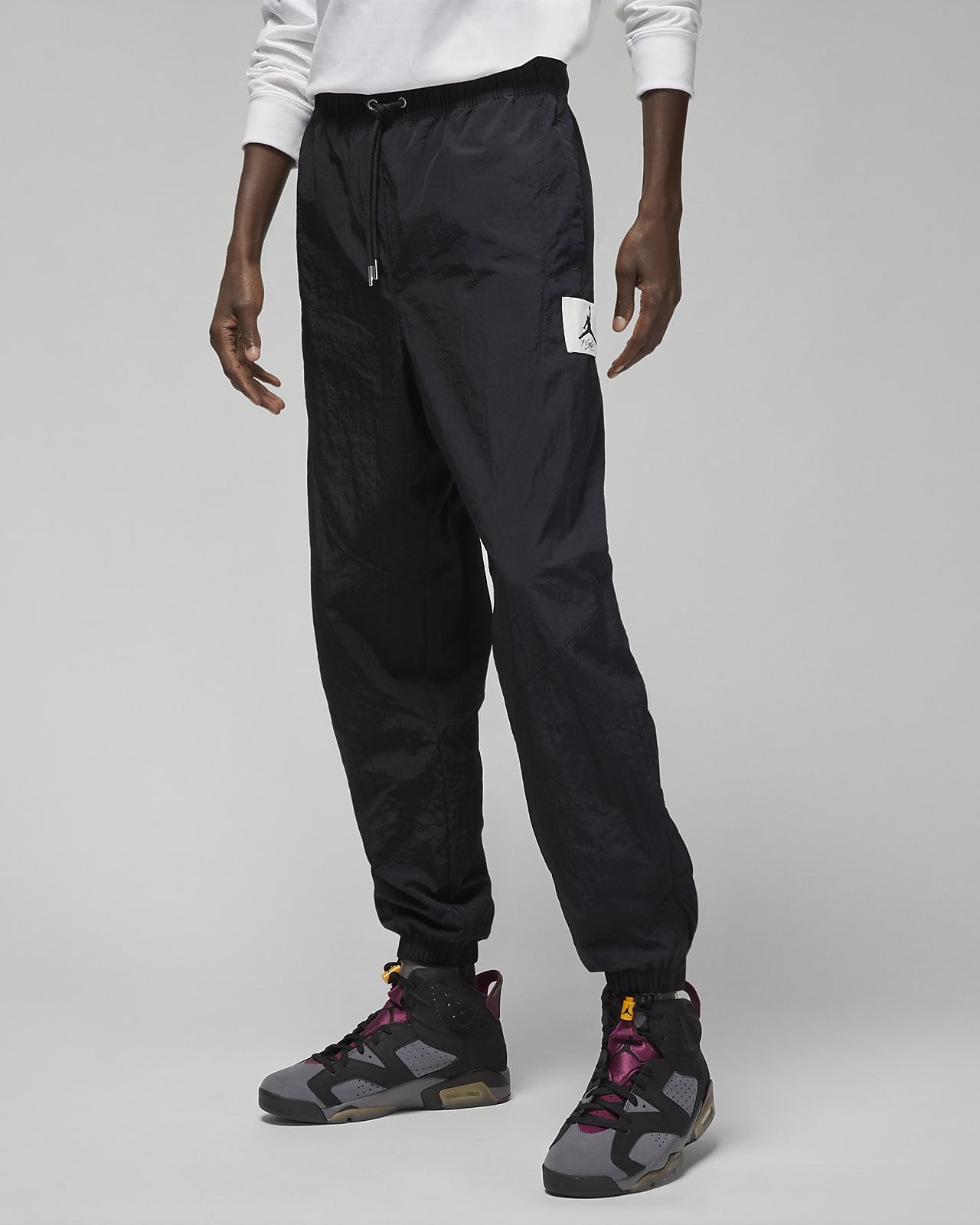 Jordan Essential Men's Statement WarmUp Trousers. Nike IE