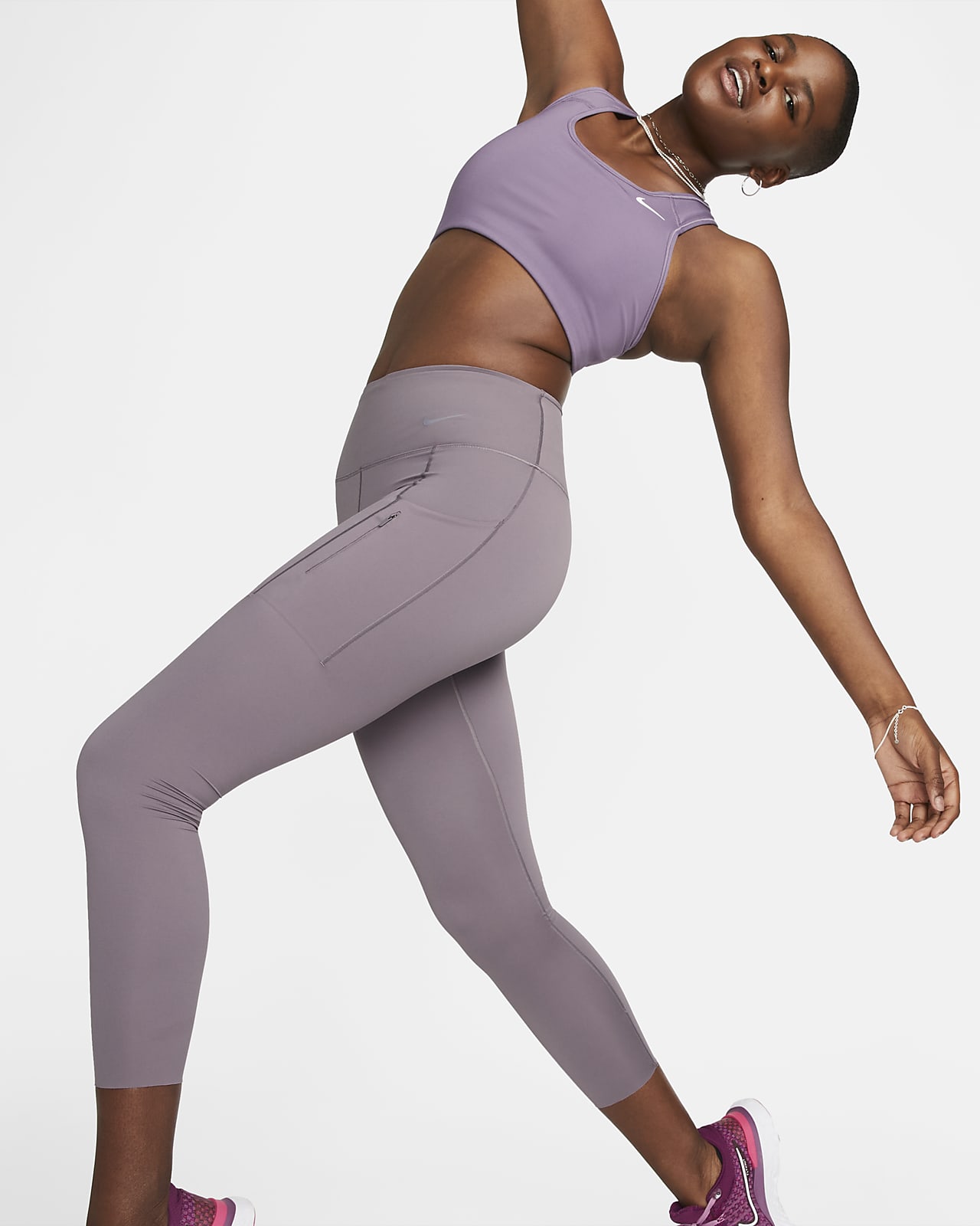 Leggings a 7/8 de cintura normal e suporte firme com bolsos Nike Go para mulher