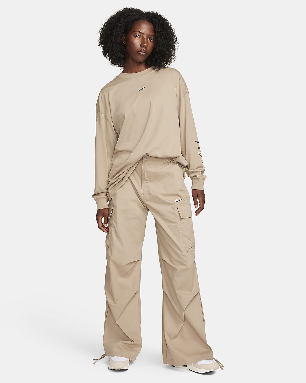 beige cargo pants with african print patch