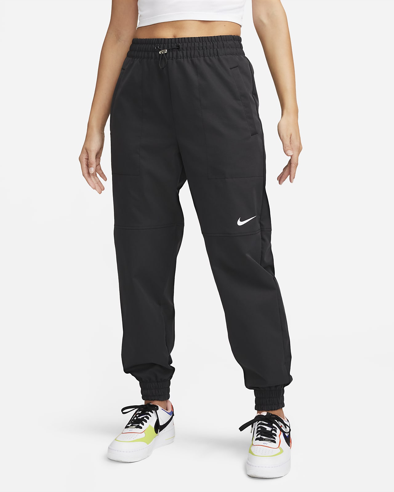 Contrato congelador Desde allí Nike Sportswear Swoosh Pantalón de tejido Woven - Mujer. Nike ES