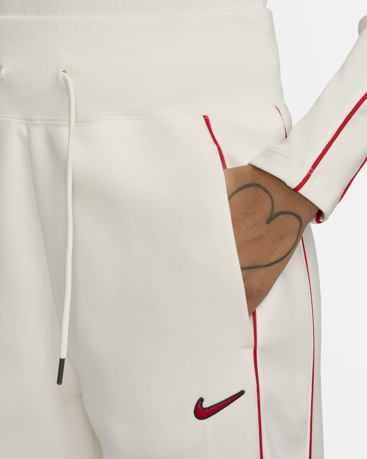 Pantaloni tuta a vita alta con orlo aperto Nike Sportswear Phoenix Fleece –  Donna