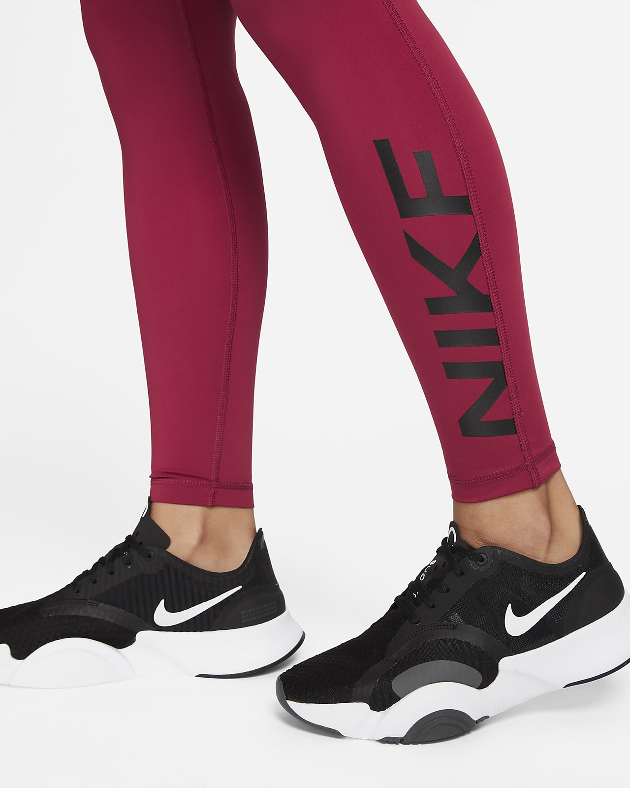 Nike Pro Dri-FIT Legging met halfhoge taille en graphic voor dames. Nike NL