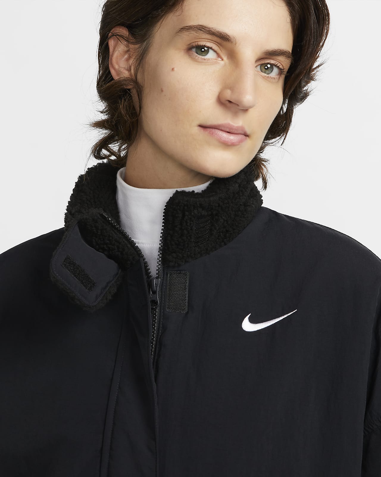 Vævet Nike Essential-fleeceforet jakke til kvinder. Nike DK