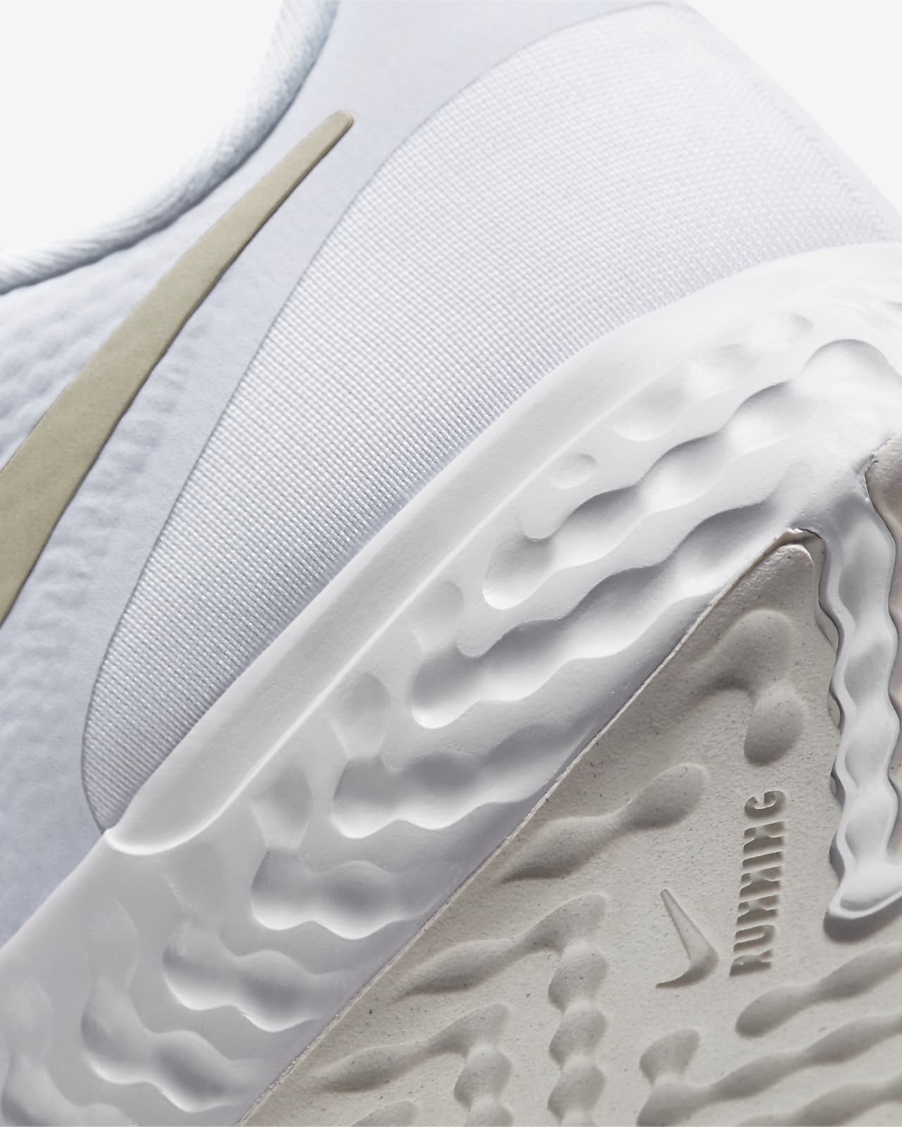 white and gold nike running shoes