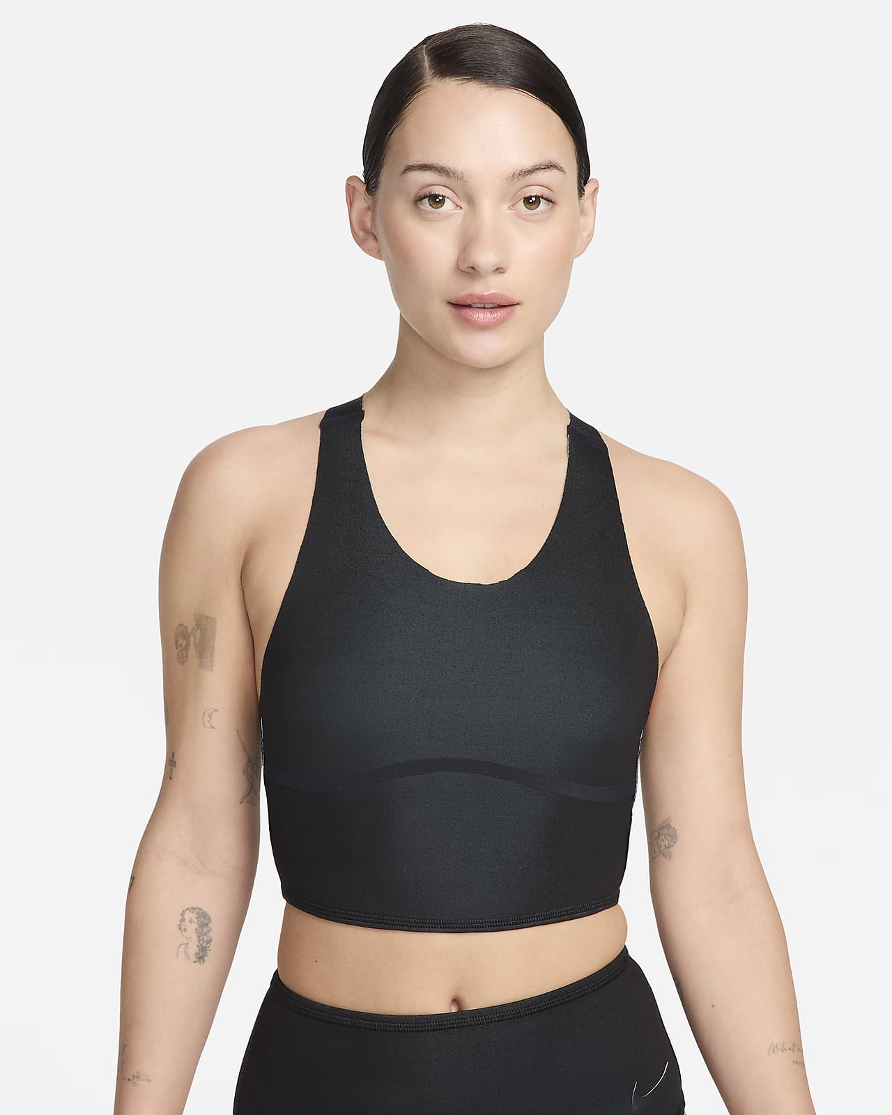 NIKE HAS A SPORTS BRA/TOP THAT CAN BE WORN TO SWIM AND ITS