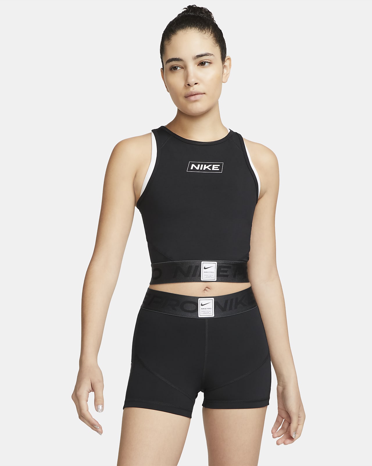 เสื้อกล้ามเอวลอยผู้หญิงมีกราฟิก Nike Pro Dri-FIT
