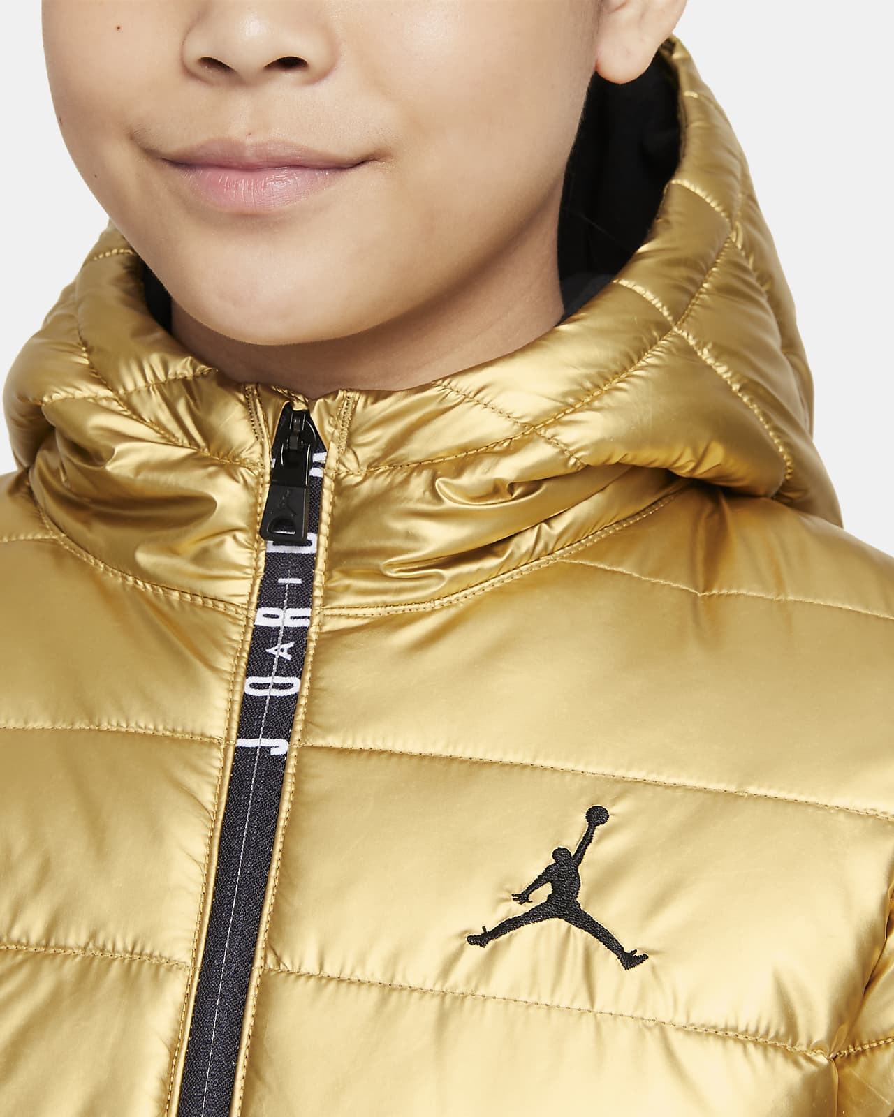 gold nike puffer