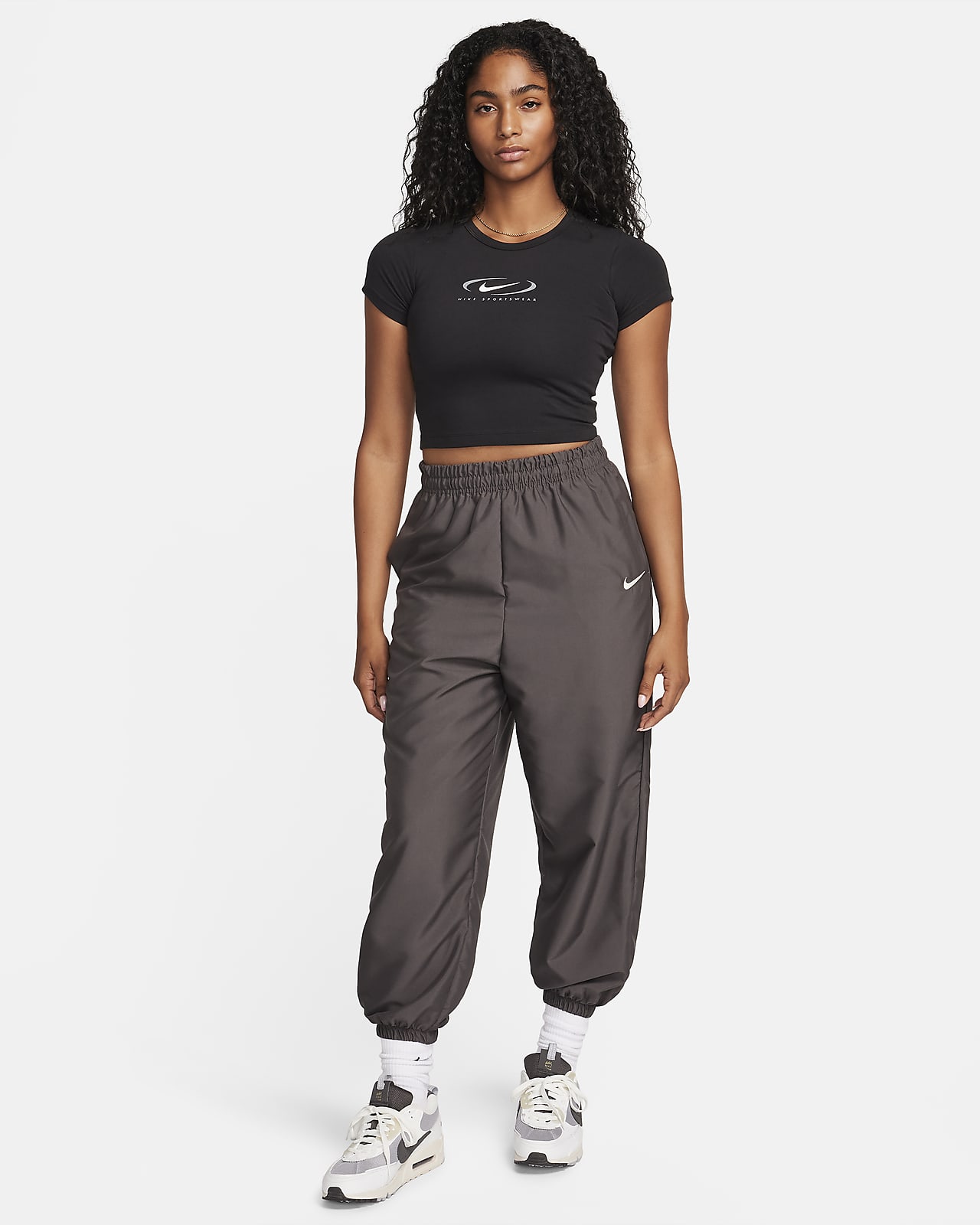 Calças cargo entrançadas Nike Sportswear para mulher. Nike PT
