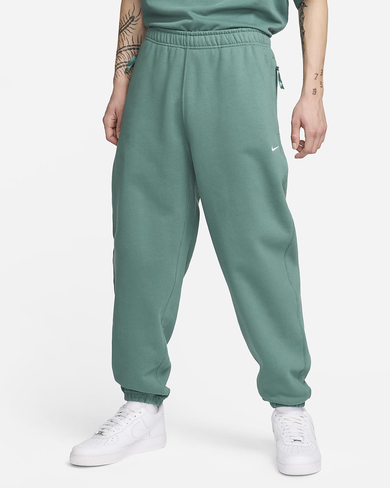 Nike Solo Swoosh Pantalons de teixit Fleece - Home