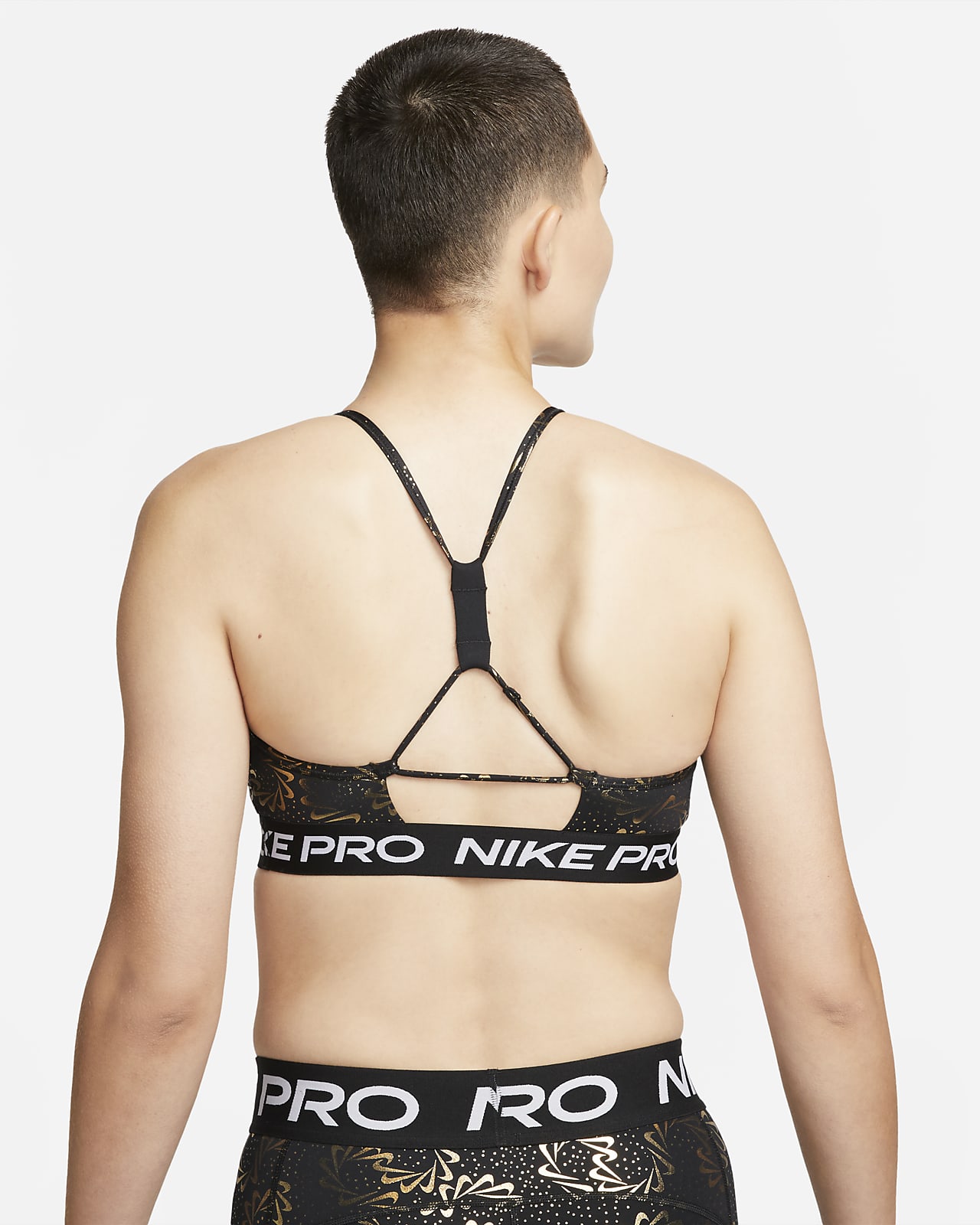 Nike Pro Indy Sujetador deportivo de sujeción ligera con almohadilla, tirantes - Mujer.