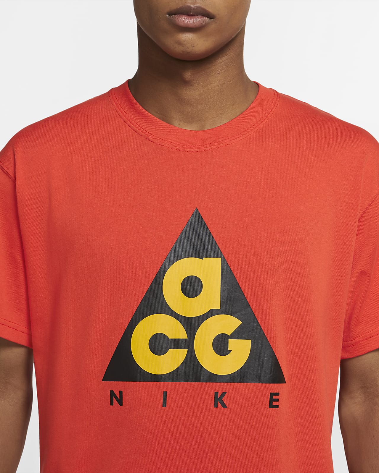 red and yellow nike shirt