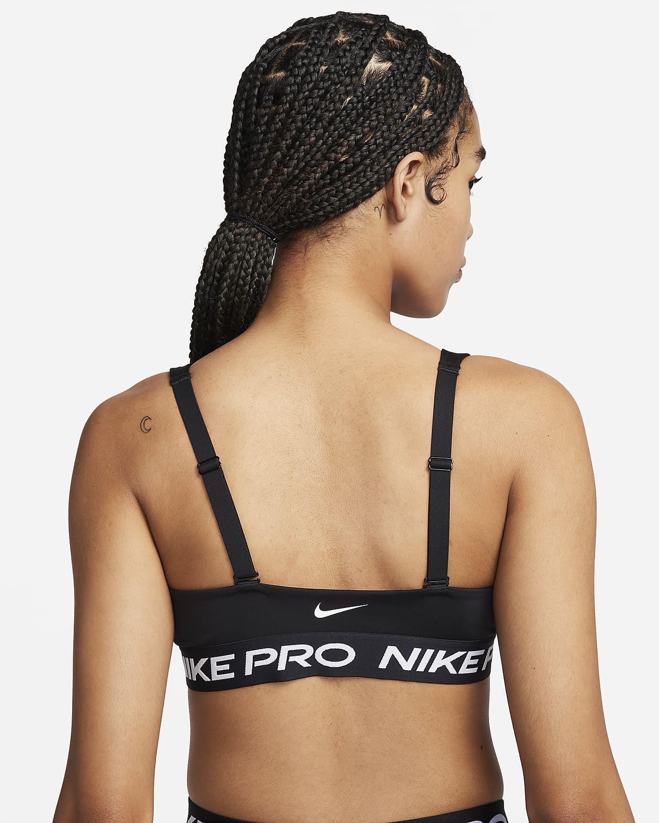Nike Training - Pro - Indy - Brassière de sport bandeau à maintien léger en  tissu Dri-FIT à motif - Noir