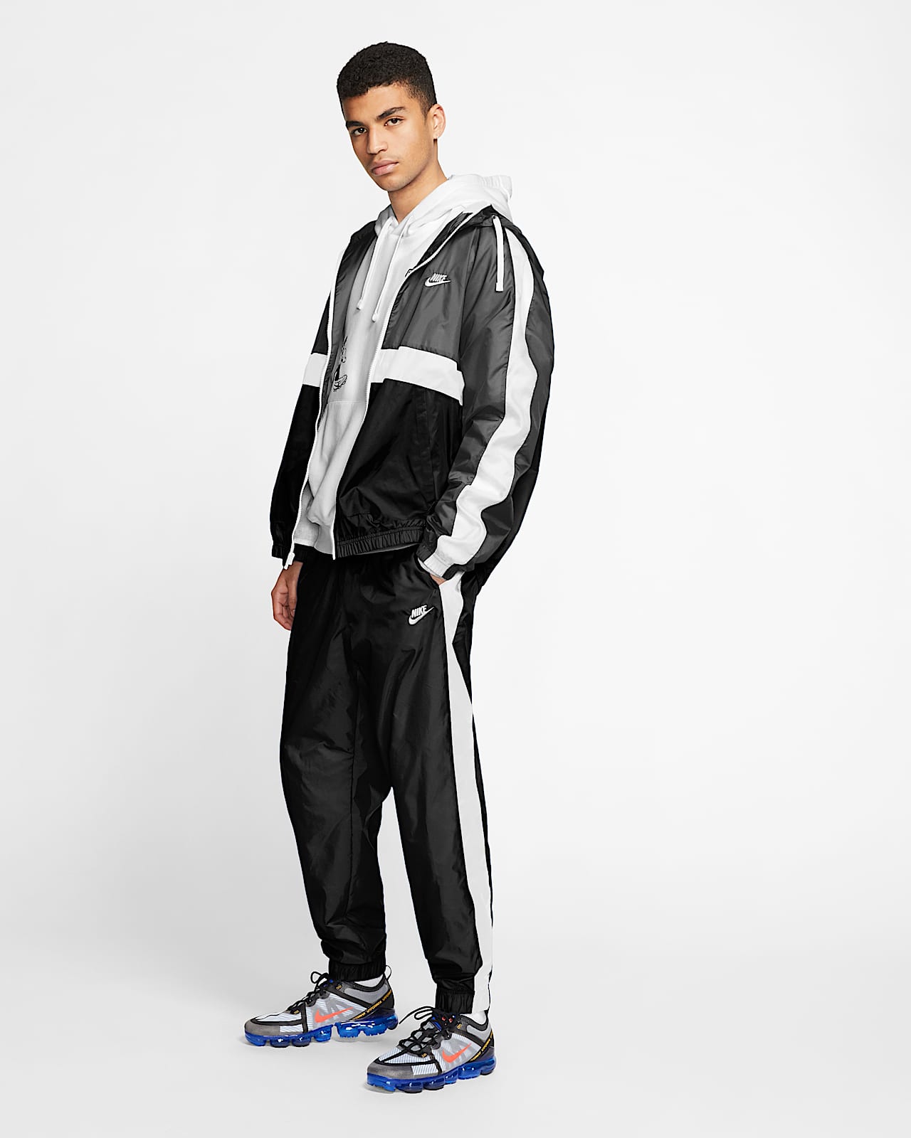Nike Sportswear Geweven trainingspak met capuchon voor heren. Nike NL