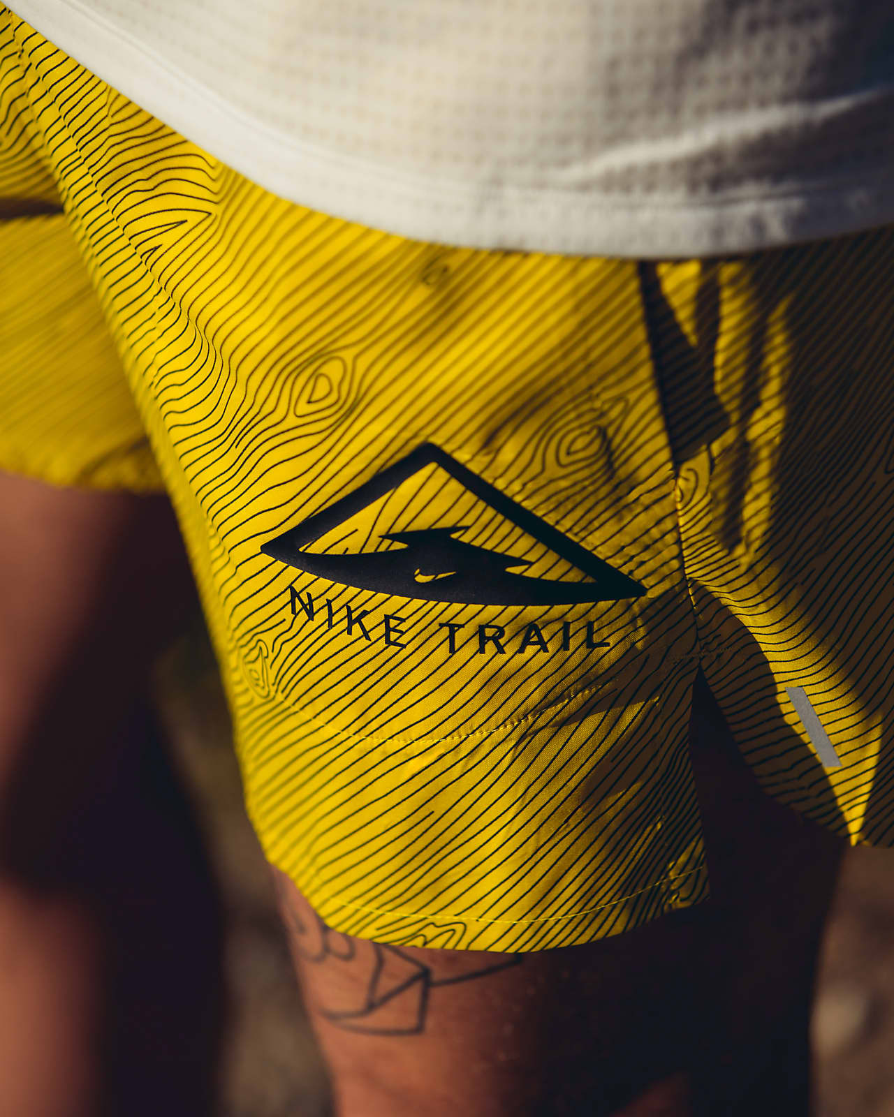 nike trail shorts yellow