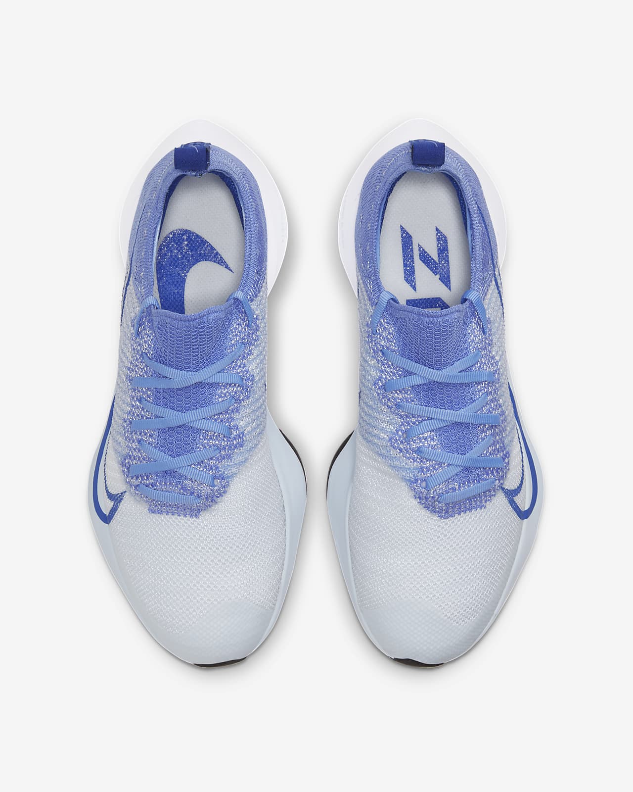 white and blue nike running shoes