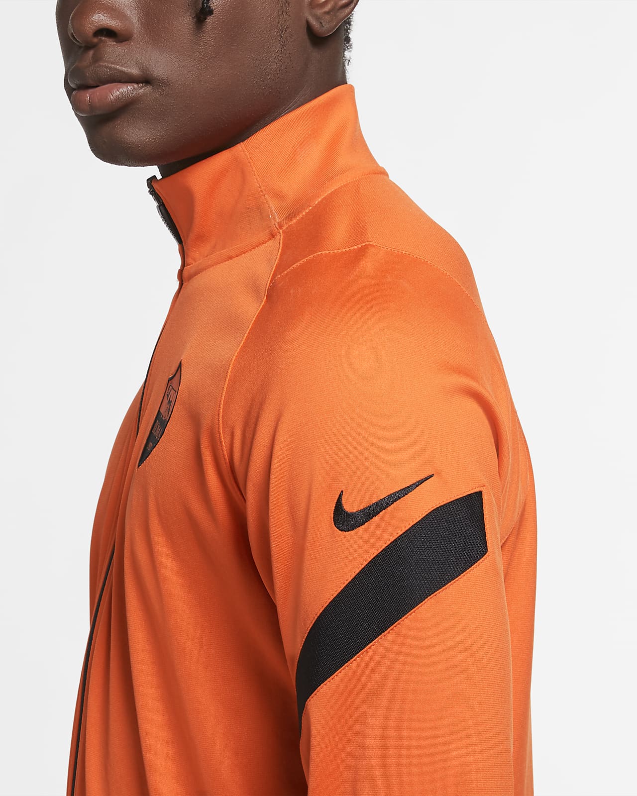 orange and black nike tracksuit