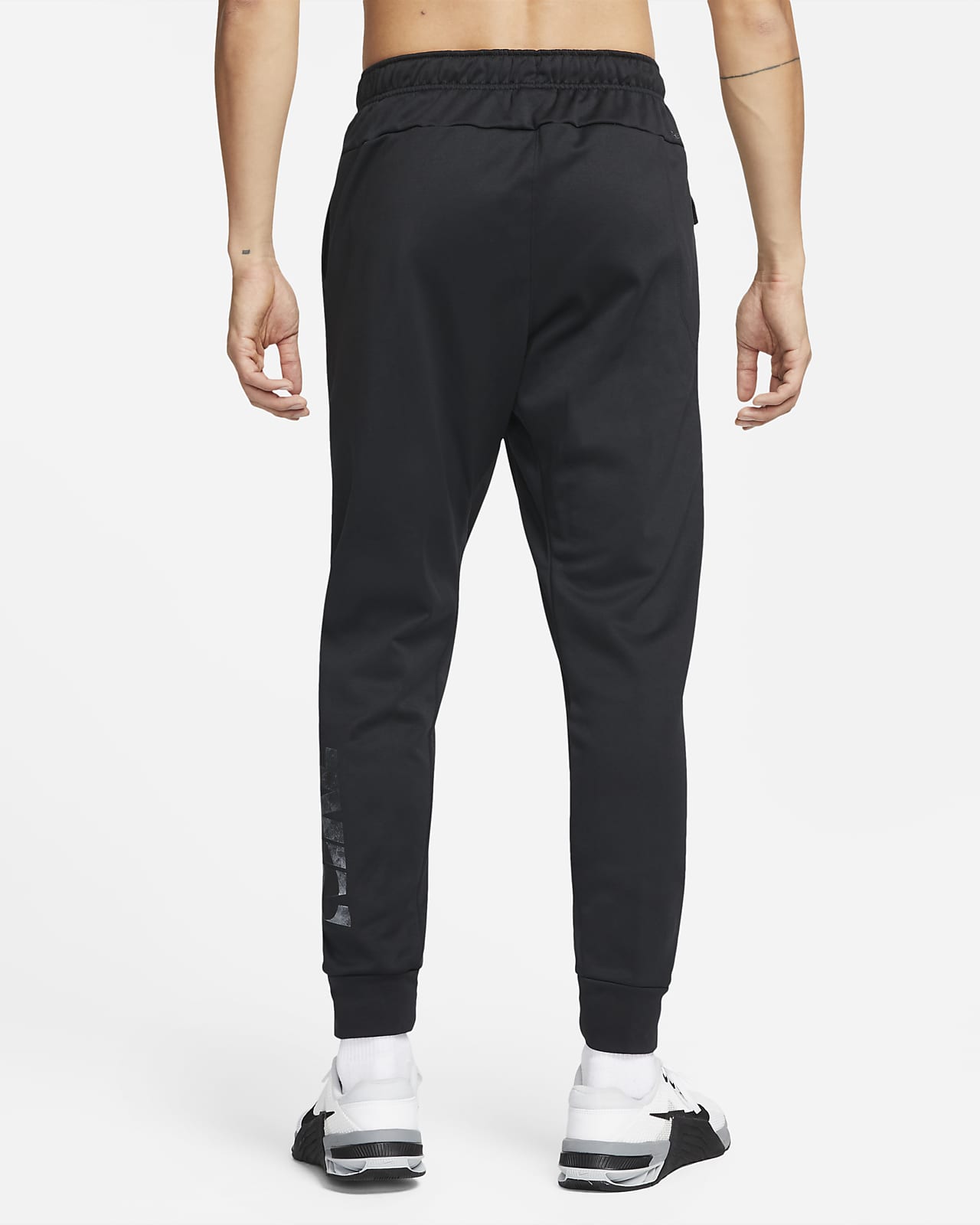 Nike Therma-FIT Men's Tapered Swoosh Graphic Fitness Trousers. Nike SE