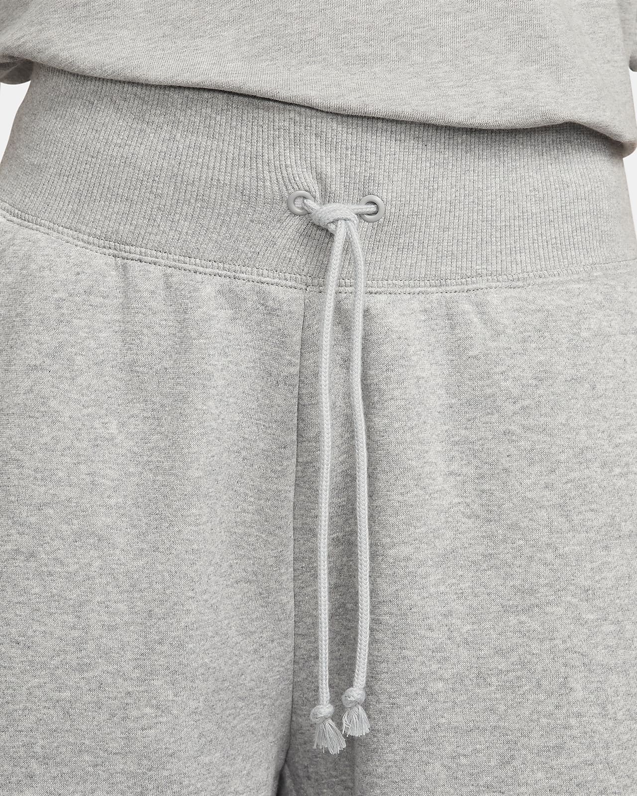 Grey nike sweatpants with black logo deals