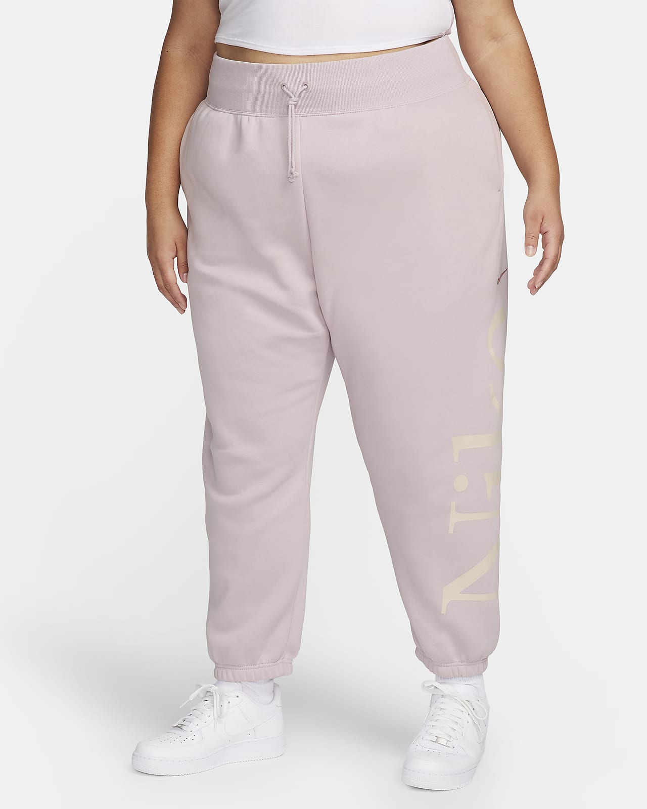 Damskie spodnie dresowe o kroju oversize z logo Nike Sportswear Phoenix Fleece (duże rozmiary)