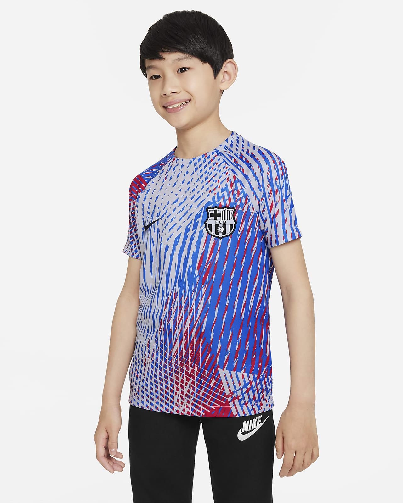 Playera de fútbol para antes del partido Nike Dri-FIT para niños talla FC Barcelona.