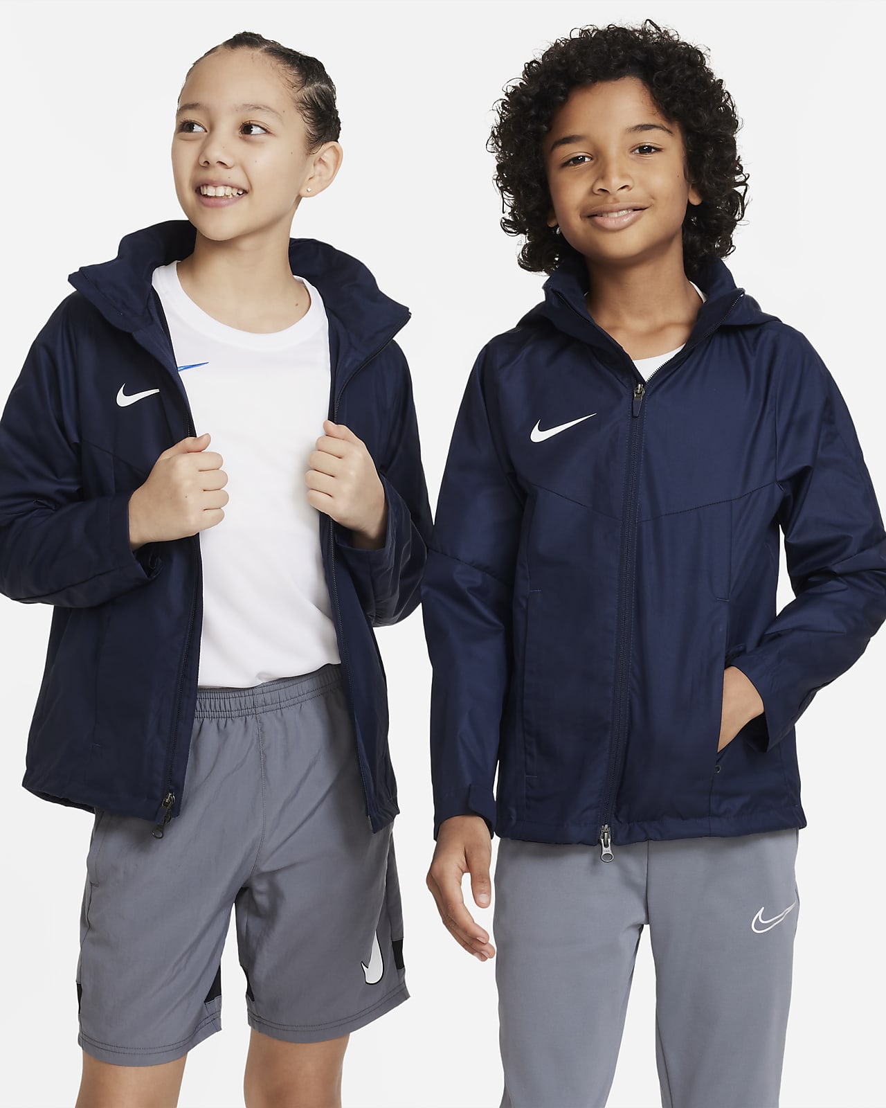 Nike Storm-FIT Academy23 Older Kids' Football Rain Jacket. Nike LU