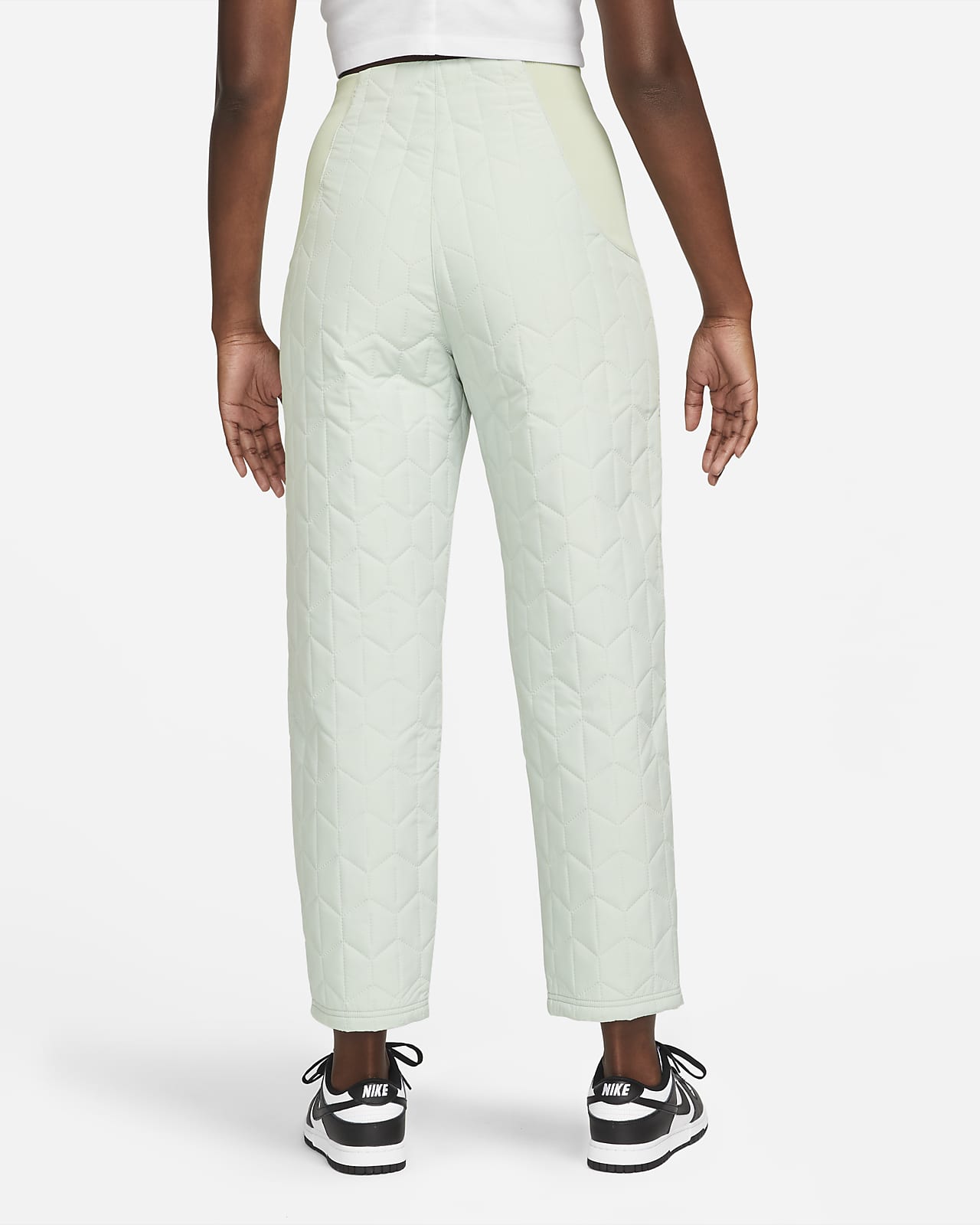 Pantaloni in tessuto trapuntato a vita alta Nike Sportswear Essentials -  Donna. Nike IT