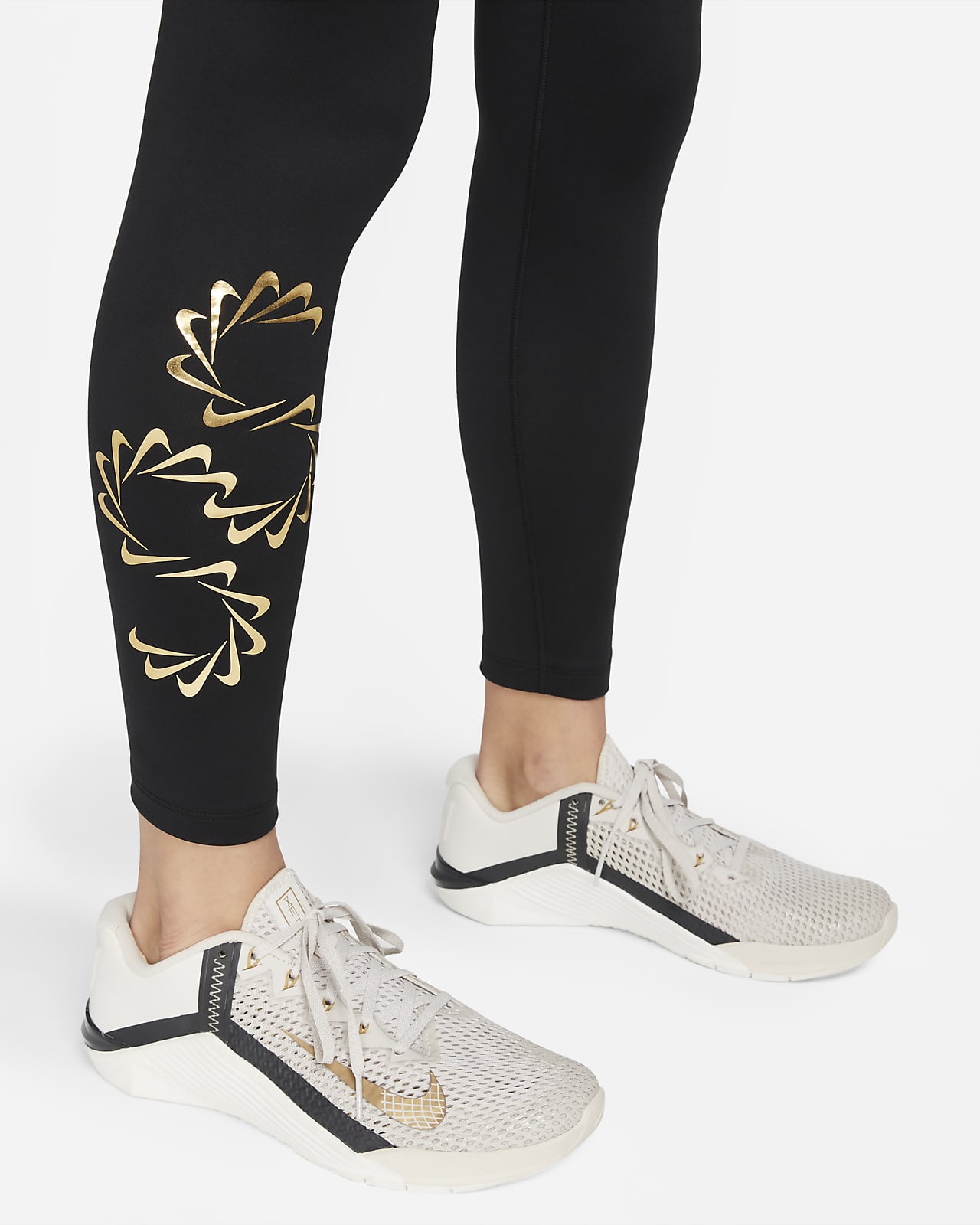 Nike Therma-FIT One Women's Mid-Rise Graphic Training Leggings.