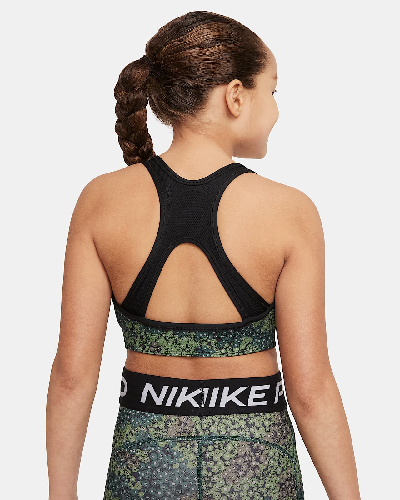 Nike Dri-FIT Swoosh Omkeerbare sport-bh met print voor meisjes. Nike BE