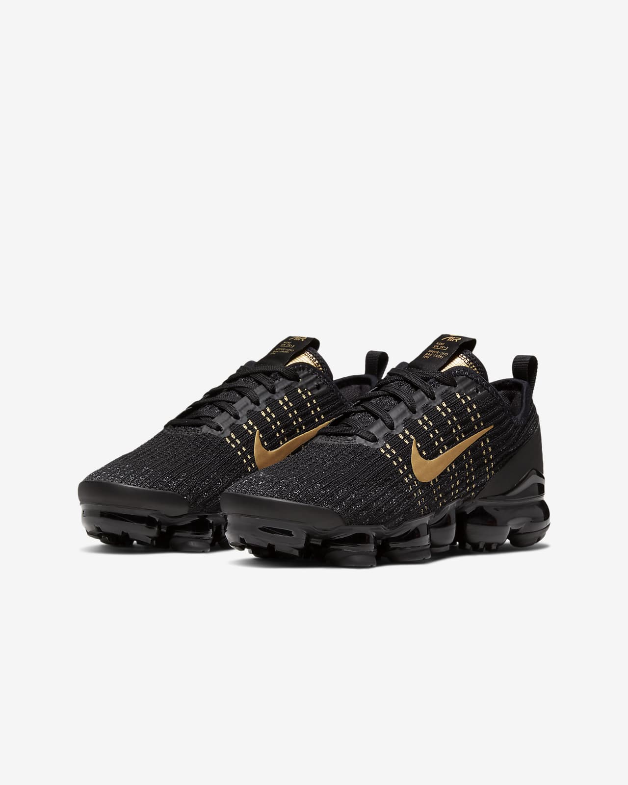 black vapormax with gold tick