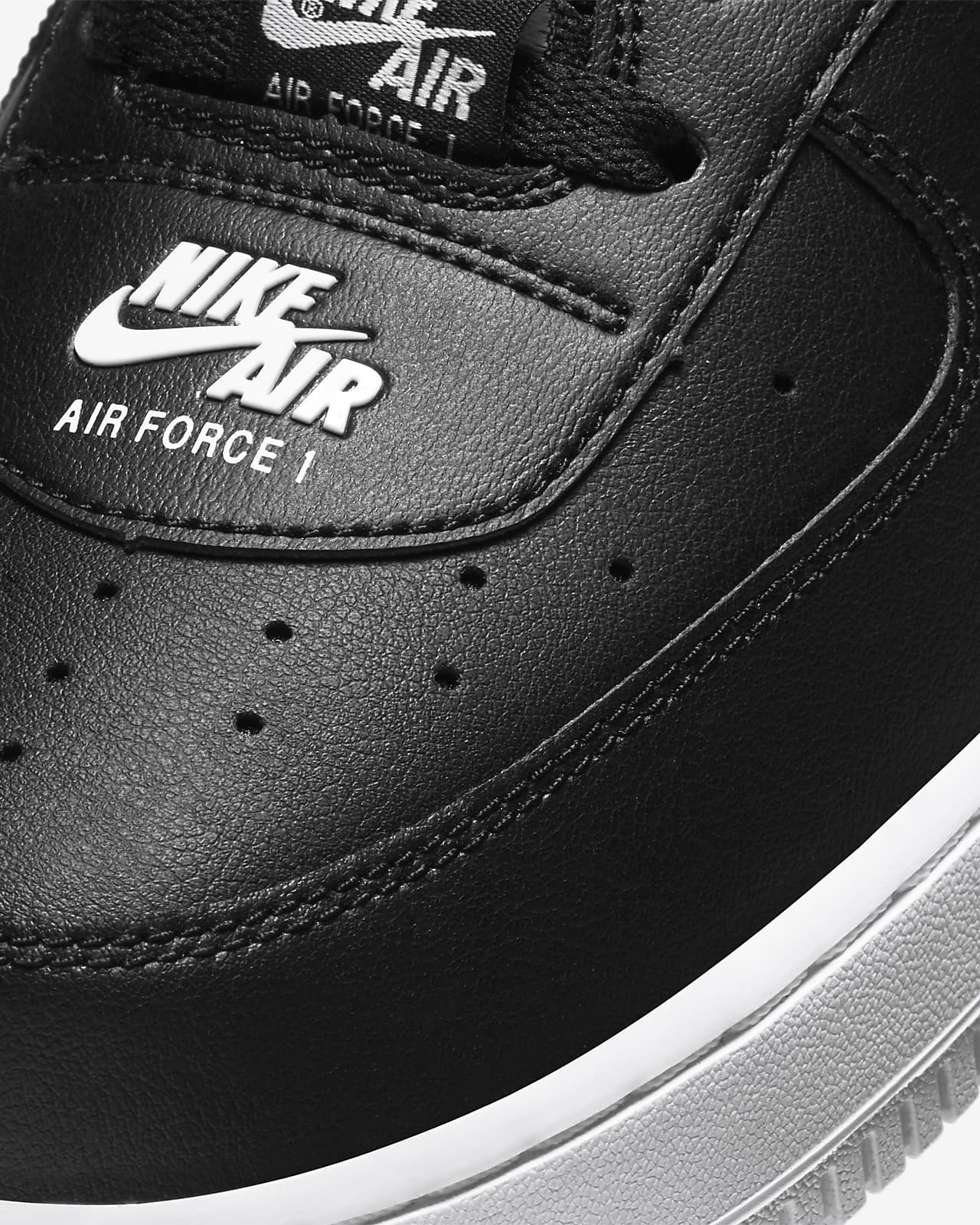 nike air force with black writing
