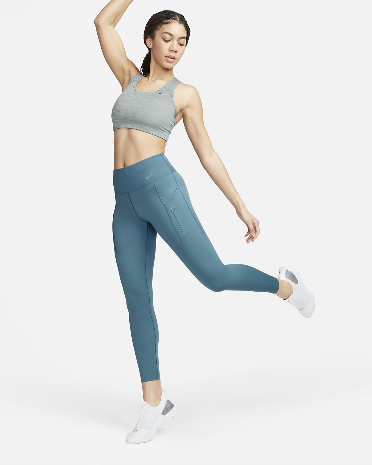 Leggings a 7/8 de cintura normal e suporte firme com bolsos Nike Go para mulher