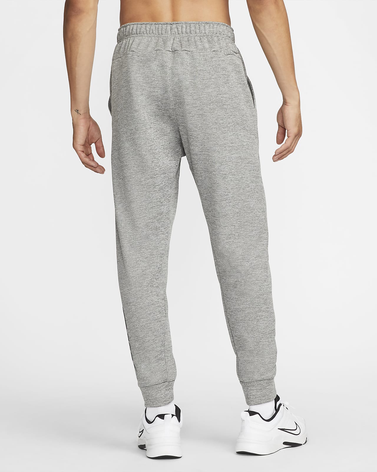 Nike Therma-FIT Men's Tapered Swoosh Graphic Fitness Trousers. Nike PT