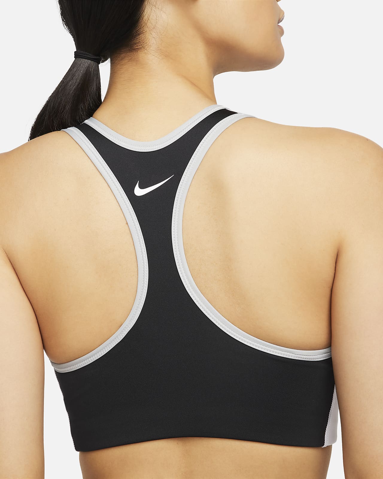 rille Staple spøgelse Nike Dri-FIT Swoosh-sports-bh med farveblokke og medium støtte og indlæg i  ét stykke til kvinder. Nike DK