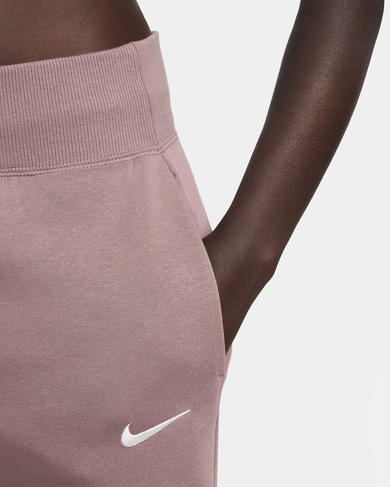 Pantaloni tuta a vita alta con orlo aperto Nike Sportswear Phoenix Fleece –  Donna