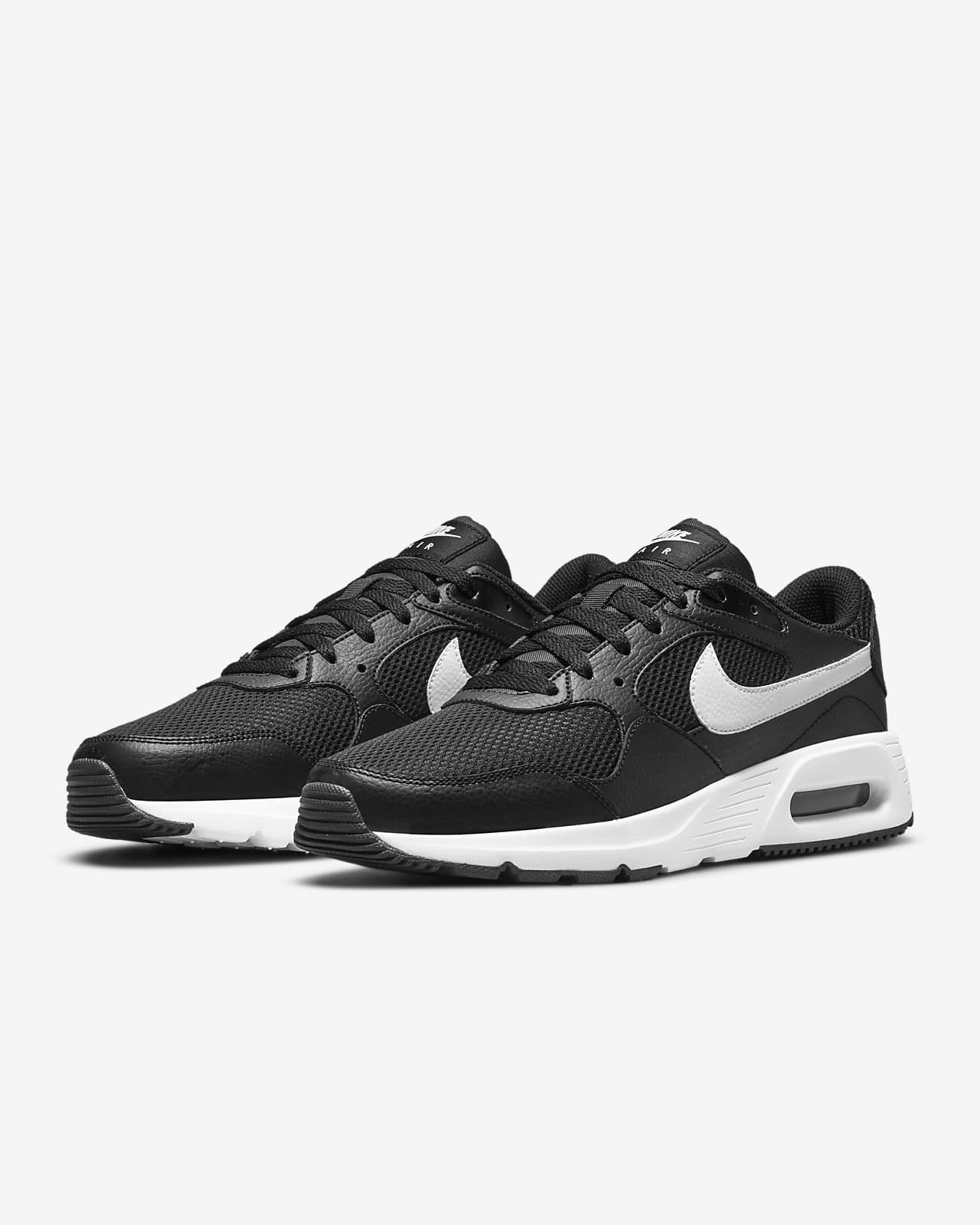 white and black nike air shoes
