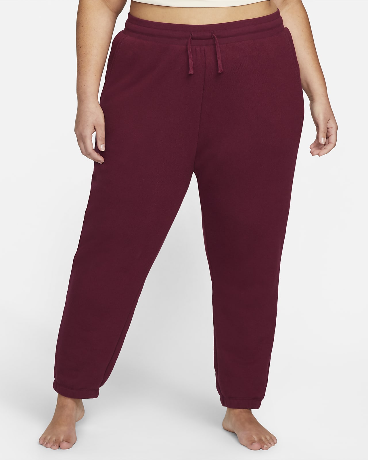 Joggers de tejido Fleece de tiro alto para mujer Nike Yoga Therma-FIT  (Talla grande). Nike.com