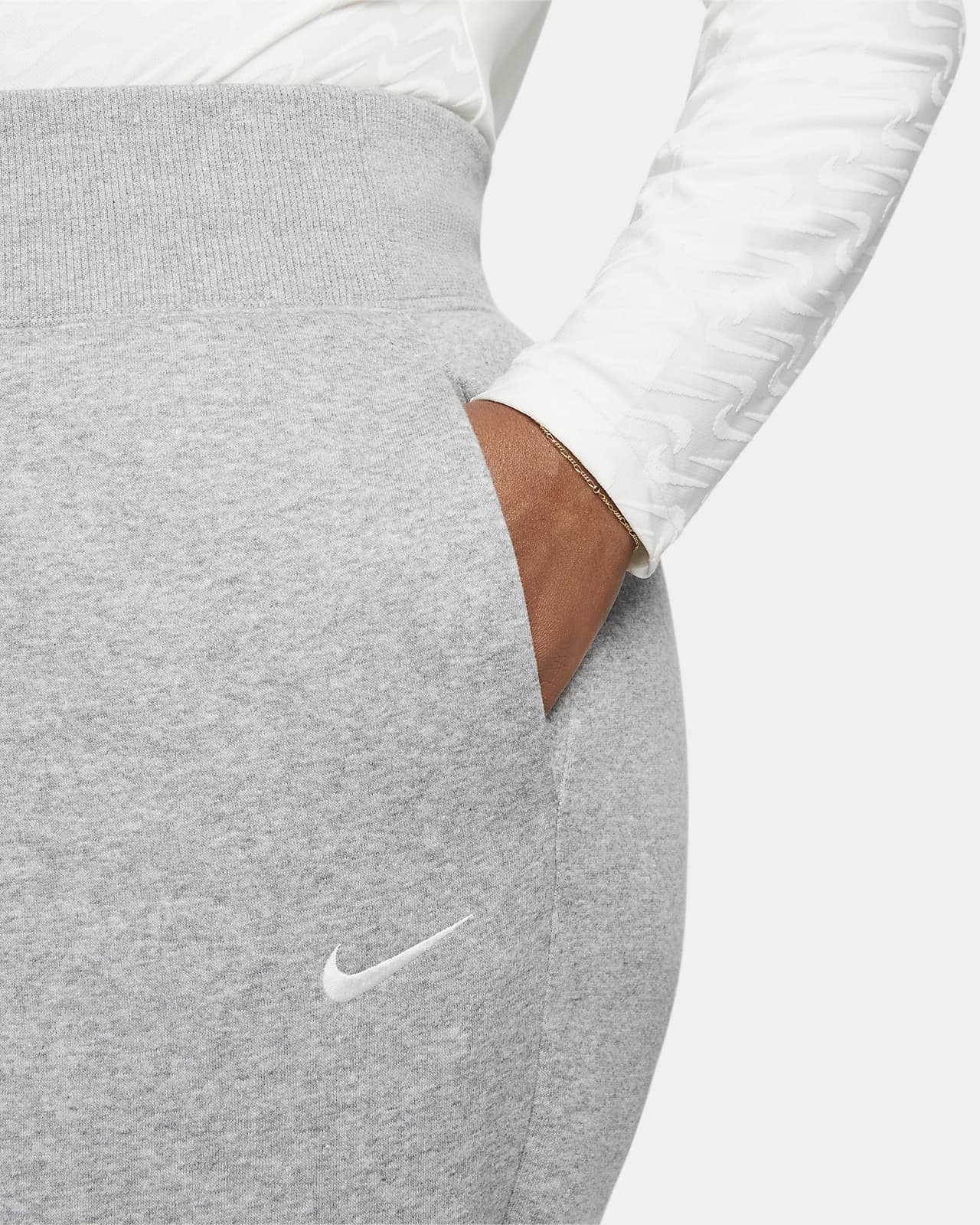 Calças de fato de treino a 7/8 delineadas de cintura subida Nike Sportswear  Phoenix Fleece para mulher. Nike PT