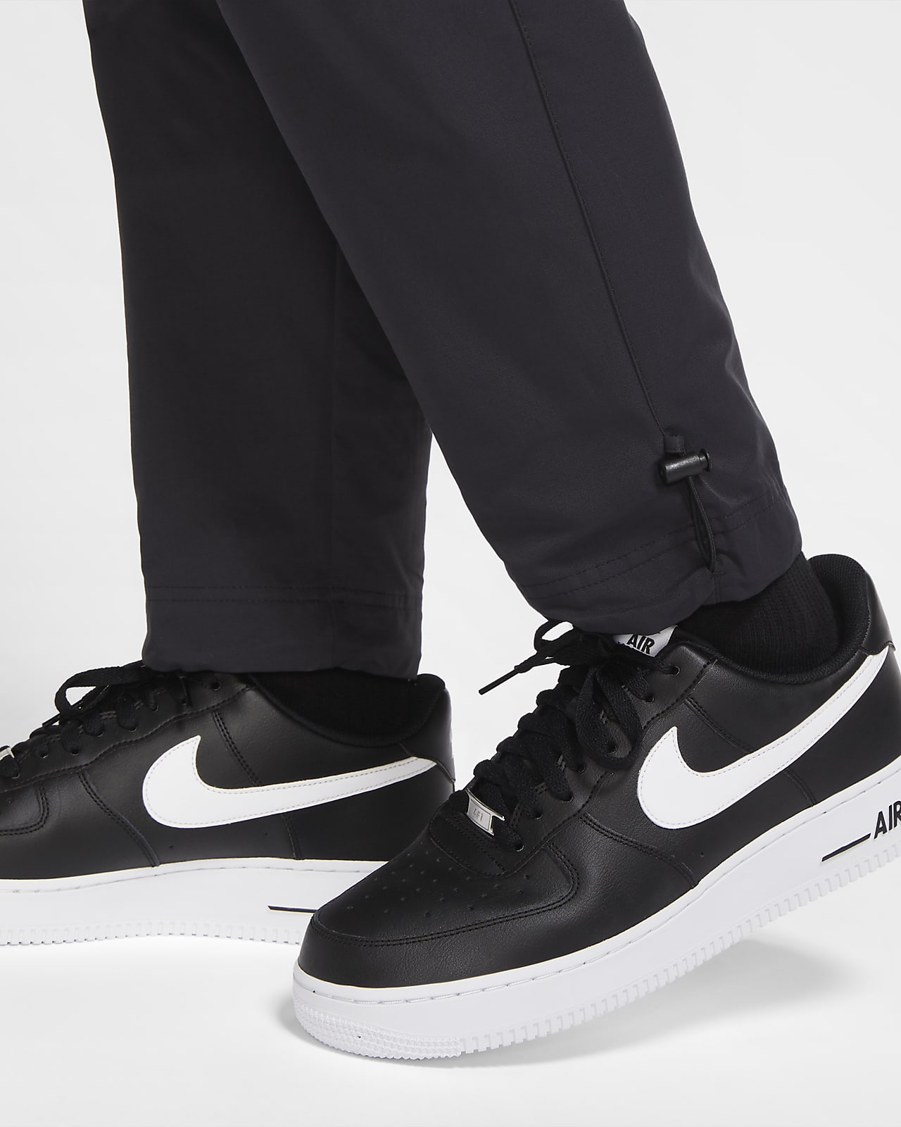 nike black pants with white stripes