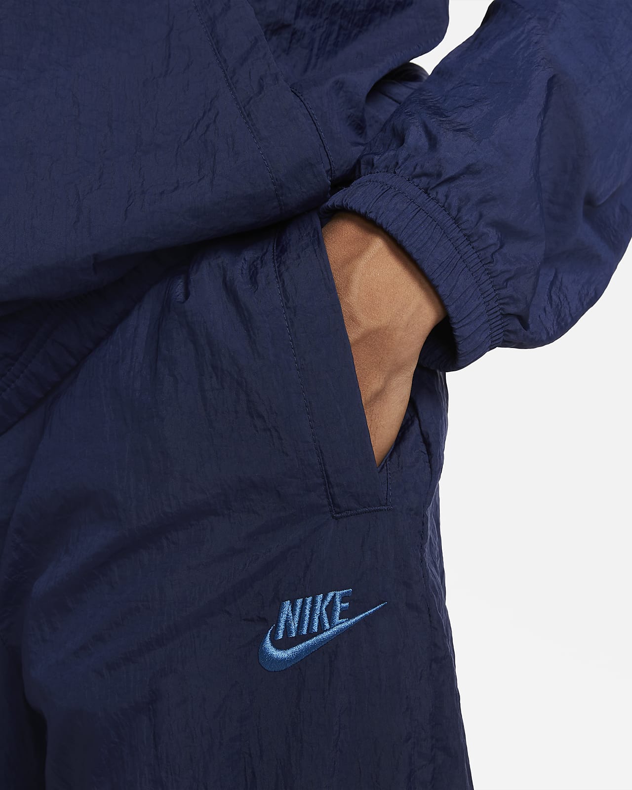 nike woven tracksuit blue