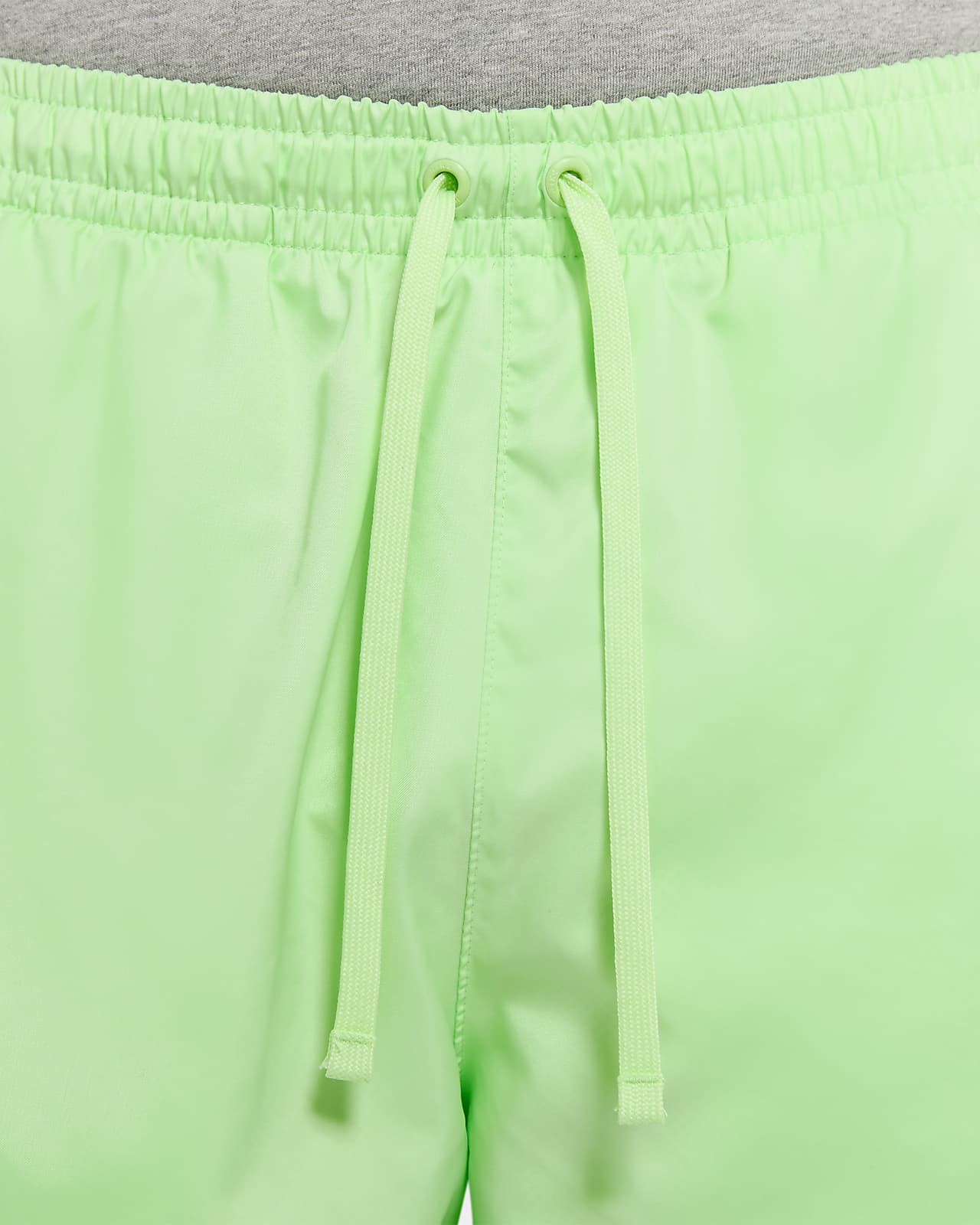 green nike woven shorts