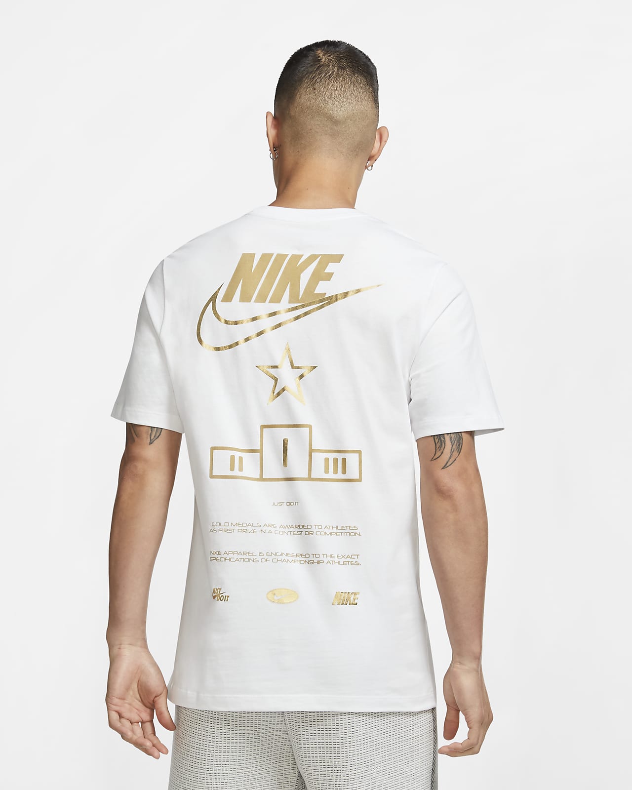 white nike shirt with gold logo 