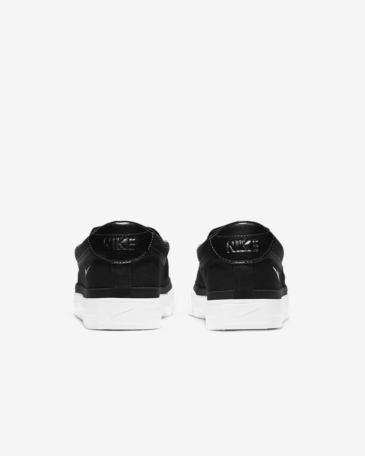 nike black and white slip ons