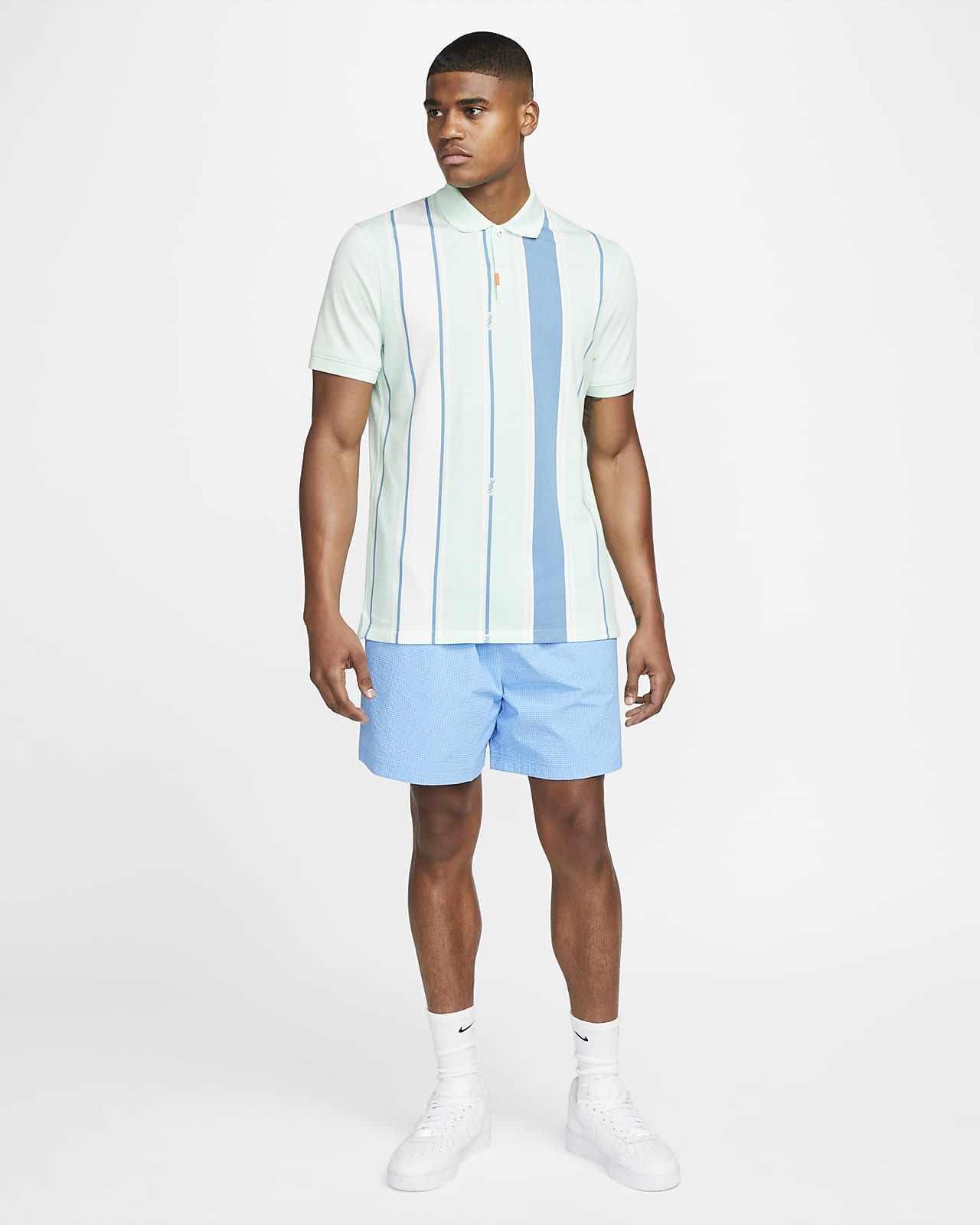 nike blue and white striped polo