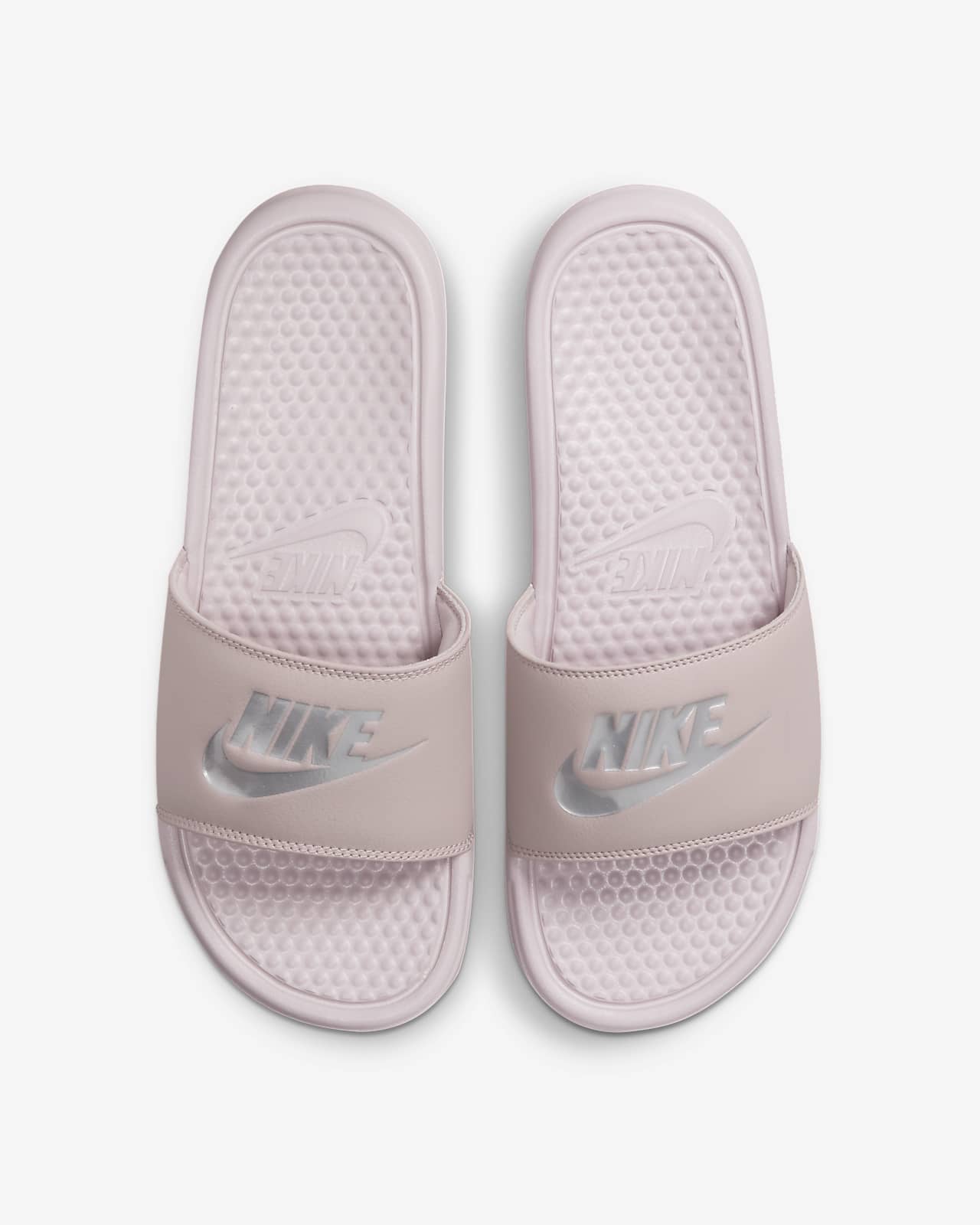 pink and white nike flip flops