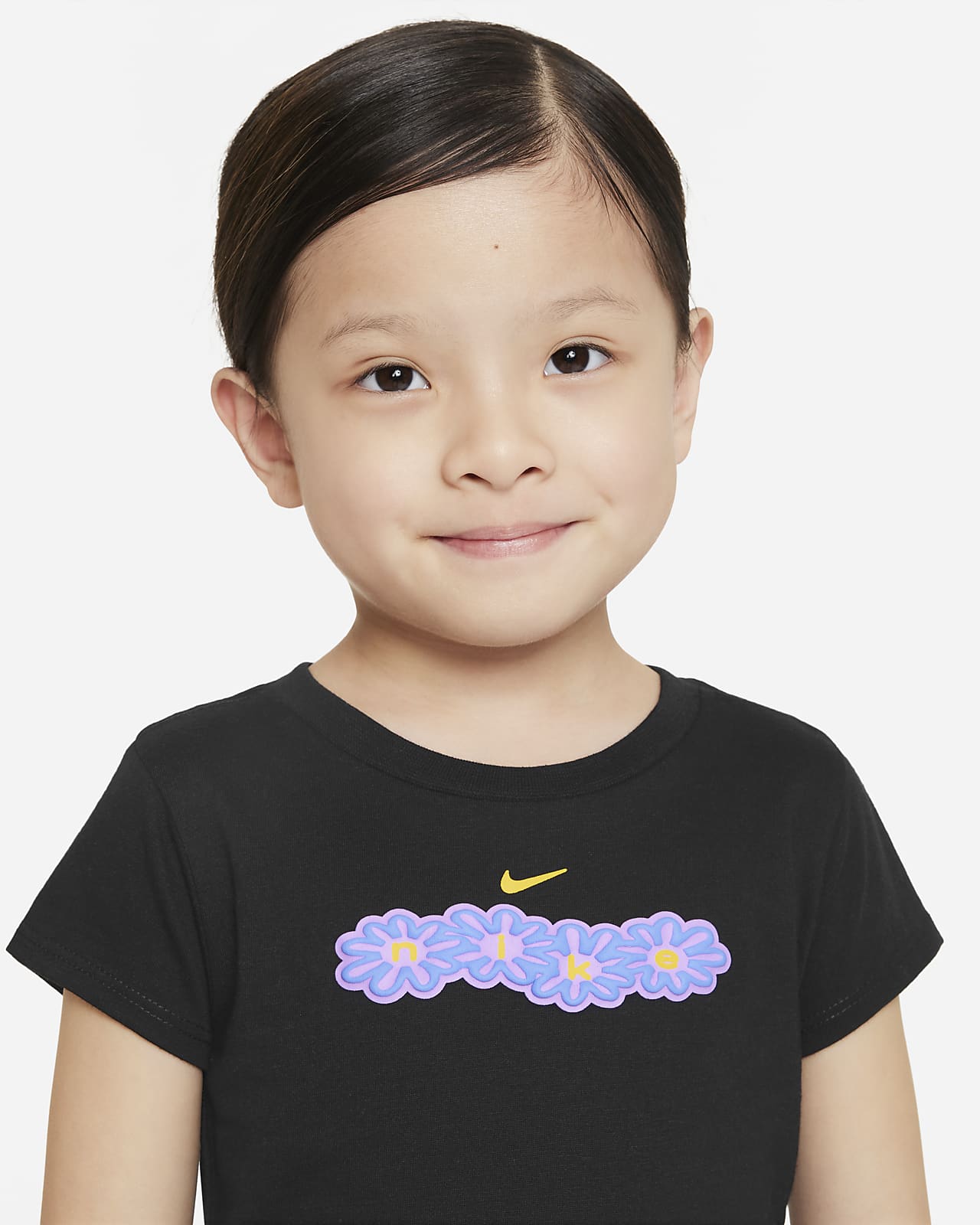 Playera infantil con gráfico de flor Nike.