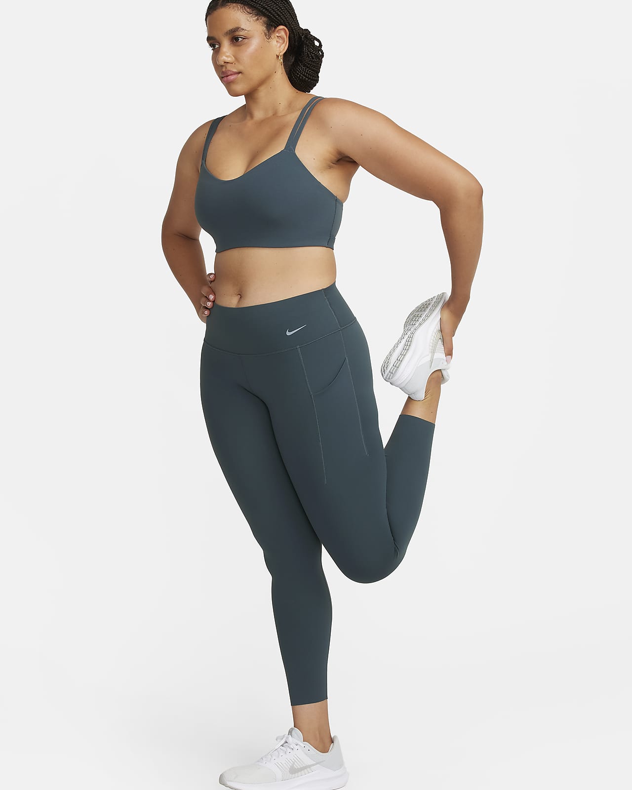 Damskie legginsy ze średnim stanem i kieszeniami o długości 7/8 zapewniające średnie wsparcie Nike Universa