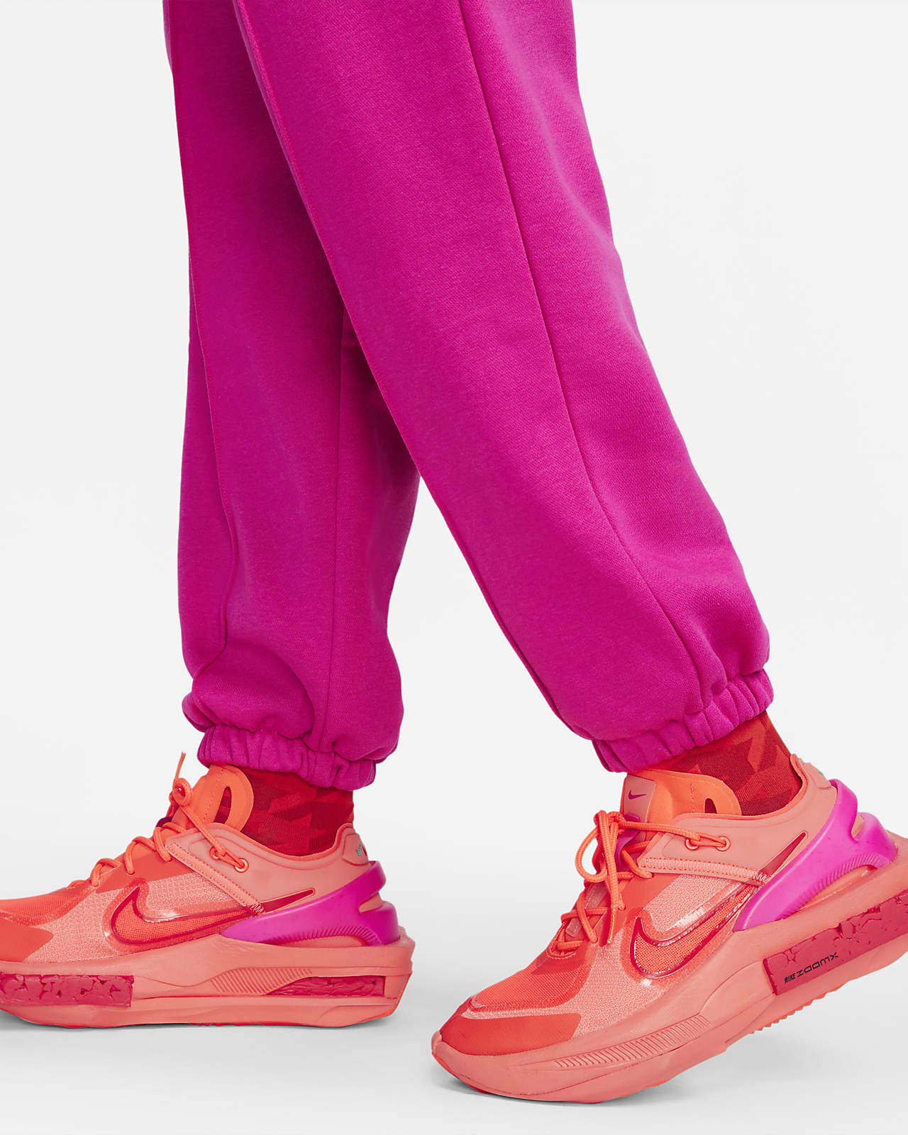 nike women's sportswear neon swoosh fleece pants orange